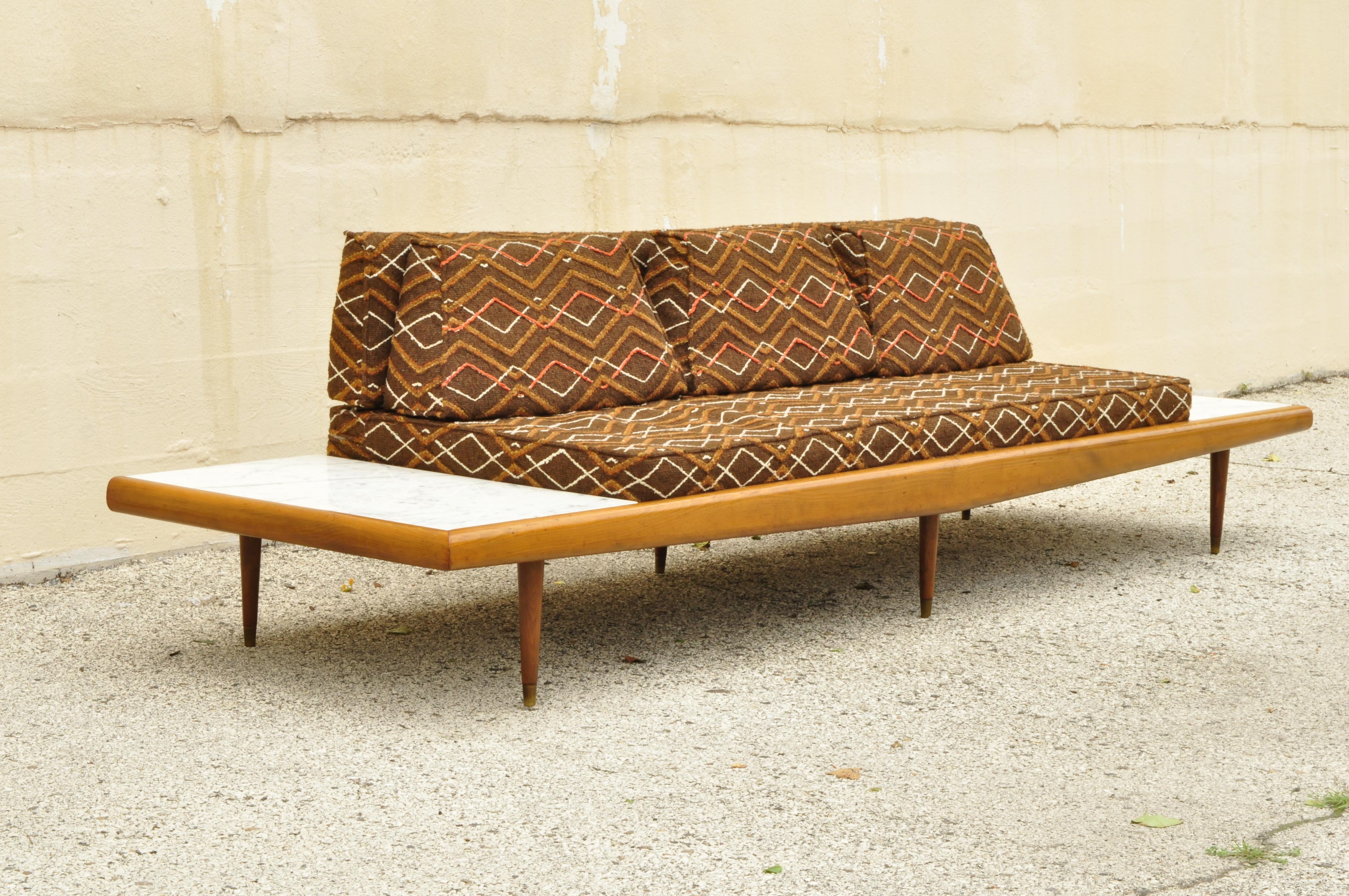 Mid-Century Modern long gondola daybed with marble attributed to Adrian Pearsall. Item features Italian white marble inset end tables , original brown loose cushions, long sleek low profile, solid wood frame, beautiful wood grain, tapered legs,