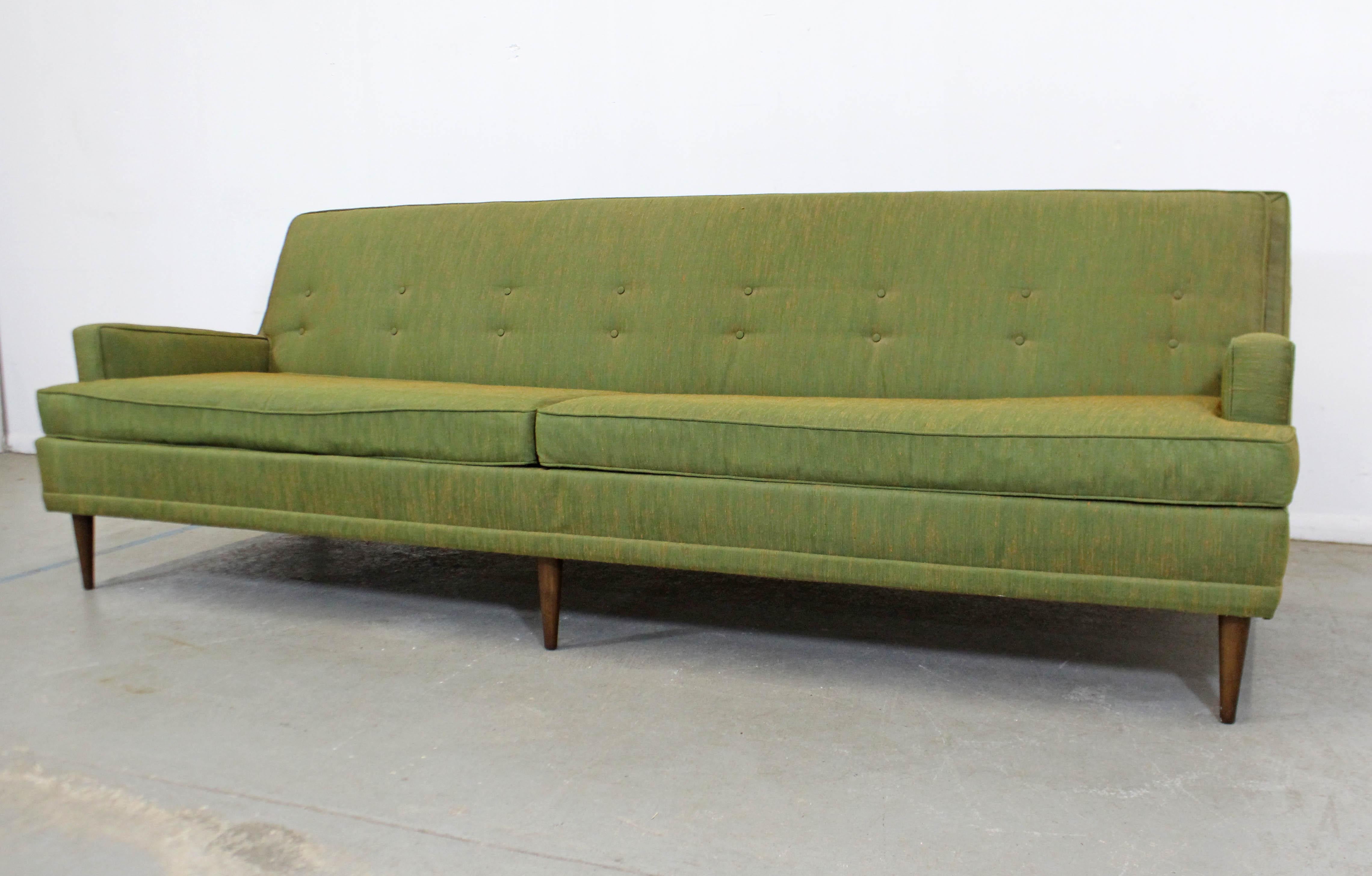 What a find. Offered is a Mid-Century Modern sofa by Kroehler. Features original green upholstery, two large seat cushions and back cushions. Seat cushions are removable, back cushions are not. It is in decent condition, but needs to reupholstered