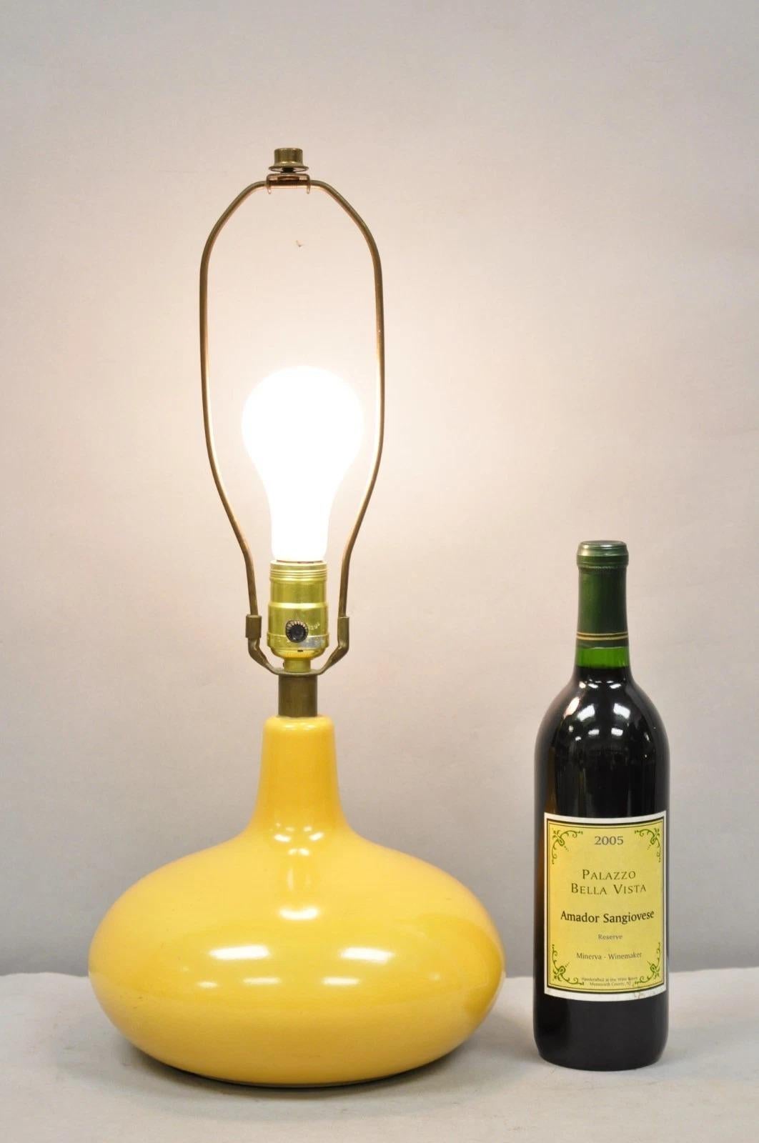 Vintage Mid Century Modern Lotte and Gunnar Bostlund Style Mustard Yellow Ceramic Table Lamp. Circa Mid 20th Century. Measurements: 20
