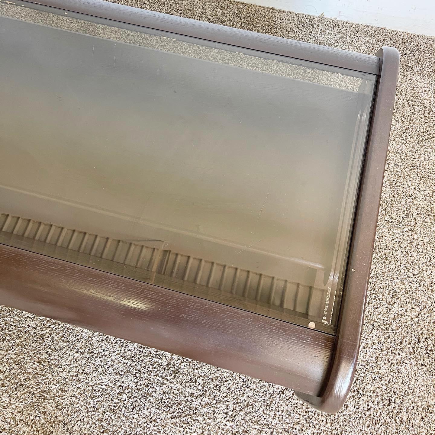 Experience timeless elegance with our Mid Century Modern Lou Hodges Style Coffee Table. With its clean lines, painted brown finish, and ample tabletop, this coffee table captures the iconic mid-century modern aesthetic.

Inspired by renowned