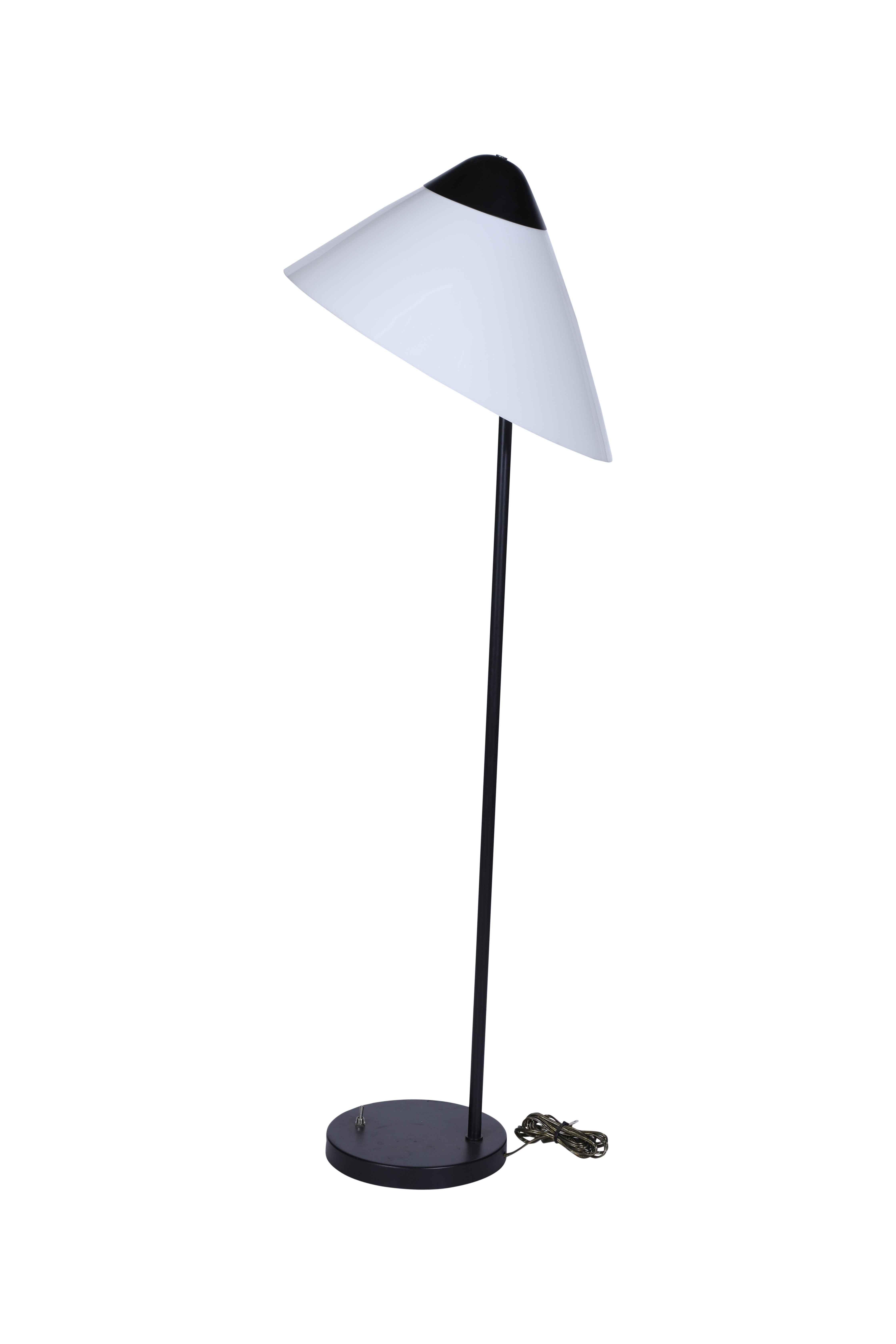 A Mid Century Modern floor lamp by Louis Poulsen, a Danish lighting manufacturer.  It is an iron base with a large asymmetrical acrylic shade.  The base itself measures 10