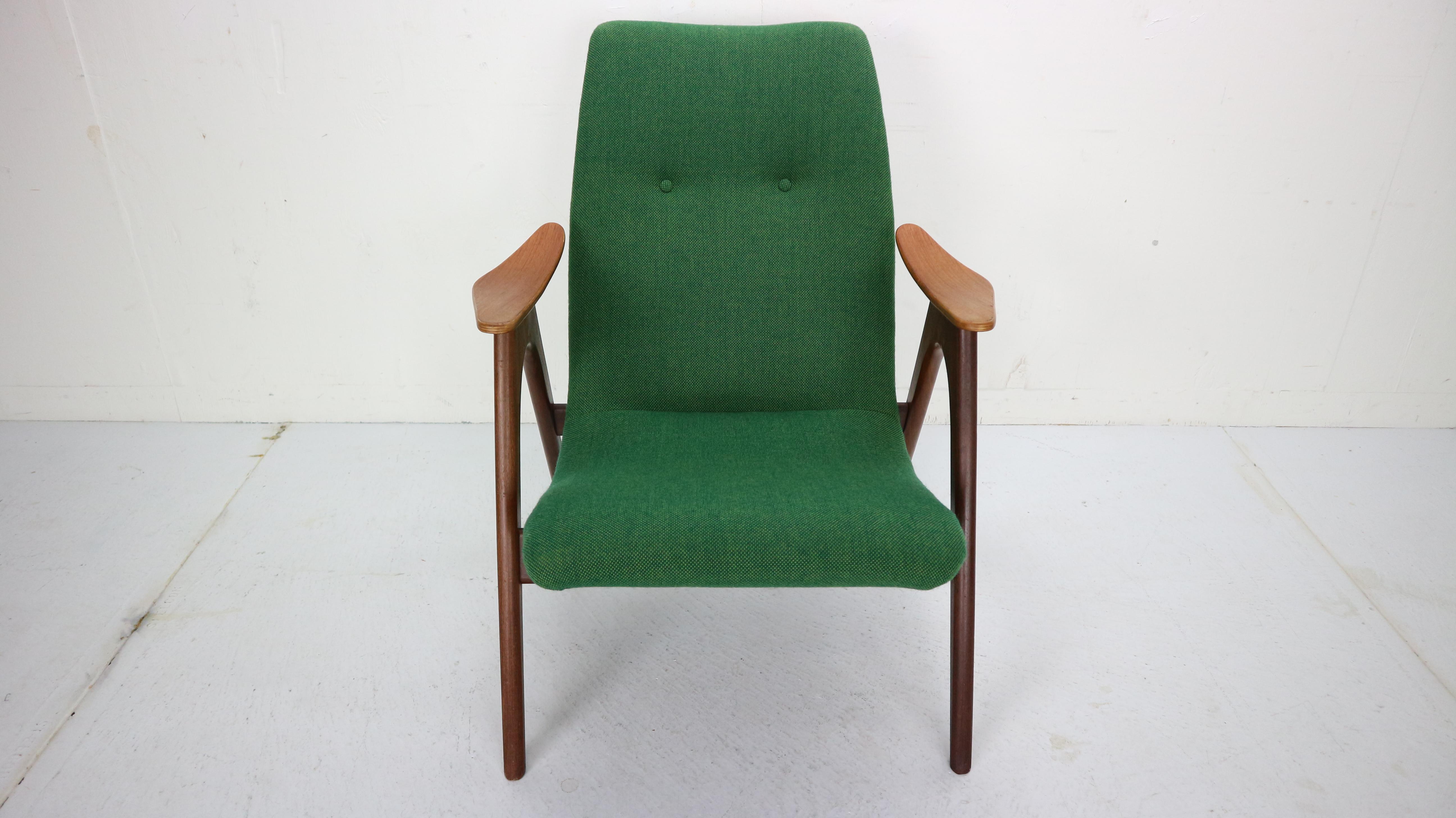Beautiful designer lounge chair with a frame of solid teak wood and newly upholstered seat with green furniture fabric. The organic design of the chair looks very Danish, but comes from the Netherlands. The armchair is designed by the Dutch designer