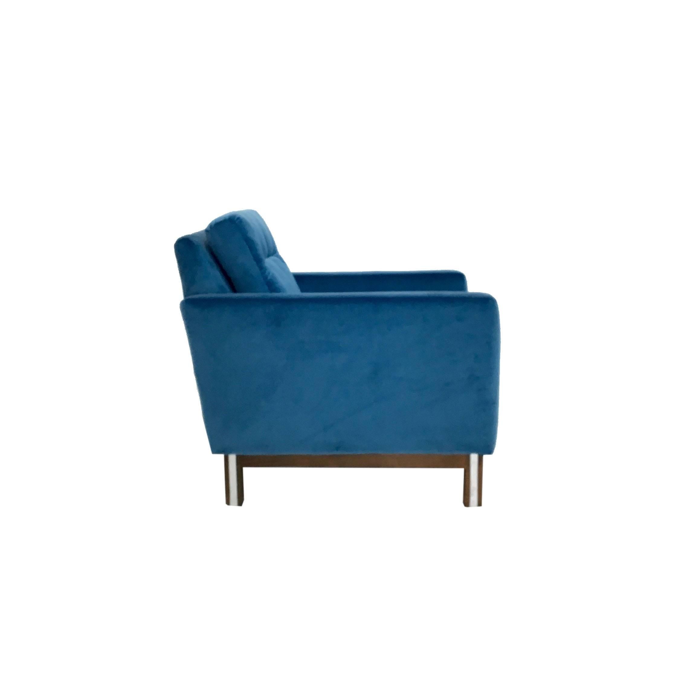 A Mid-Century Modern lounge chair in electric blue velvet. Base is chrome and wood frame. 
Measurements: 29.5