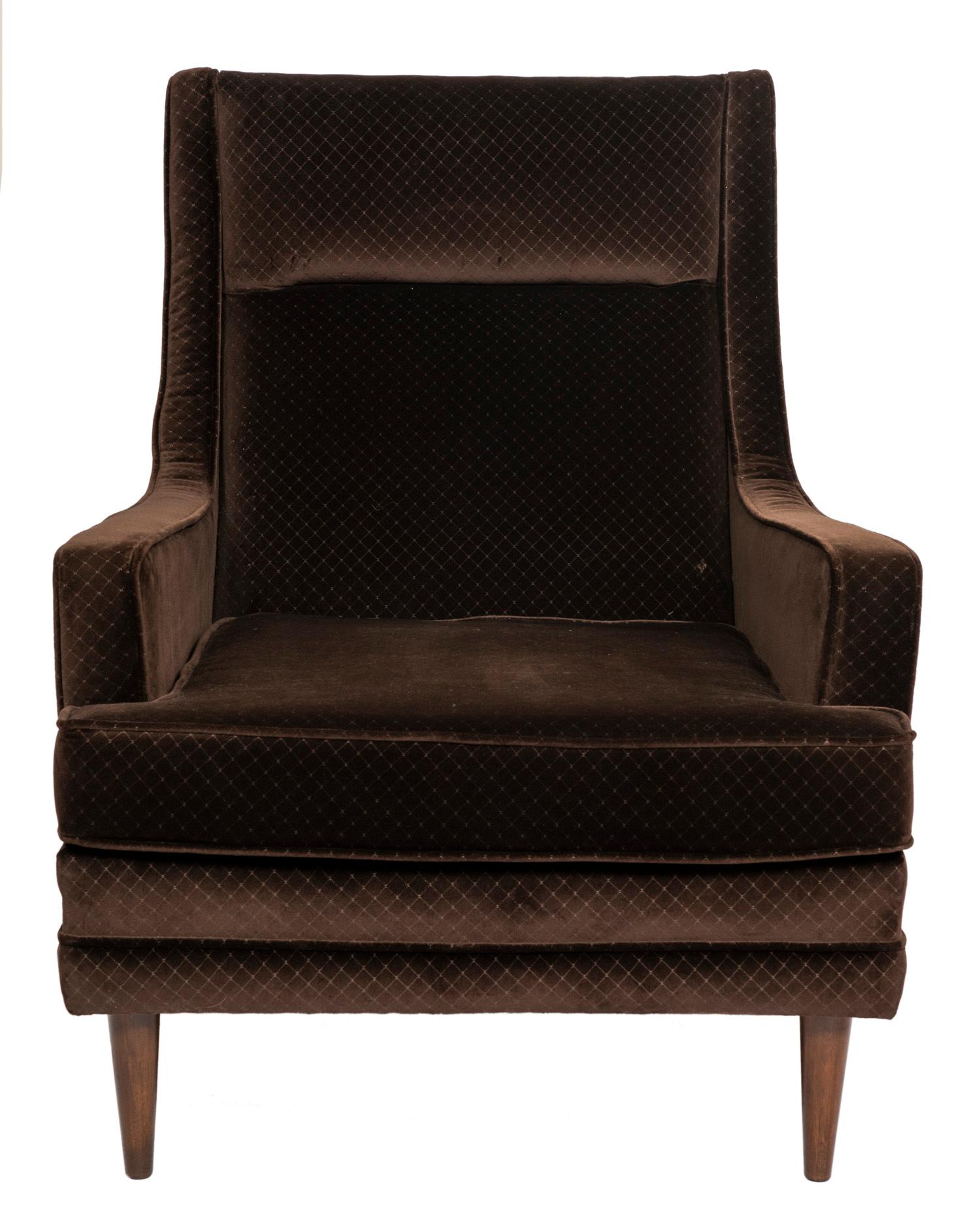 This large and stylish 1950s lounge chair and ottoman is in a plush chocolate brown velvet upholstery with a subtle 