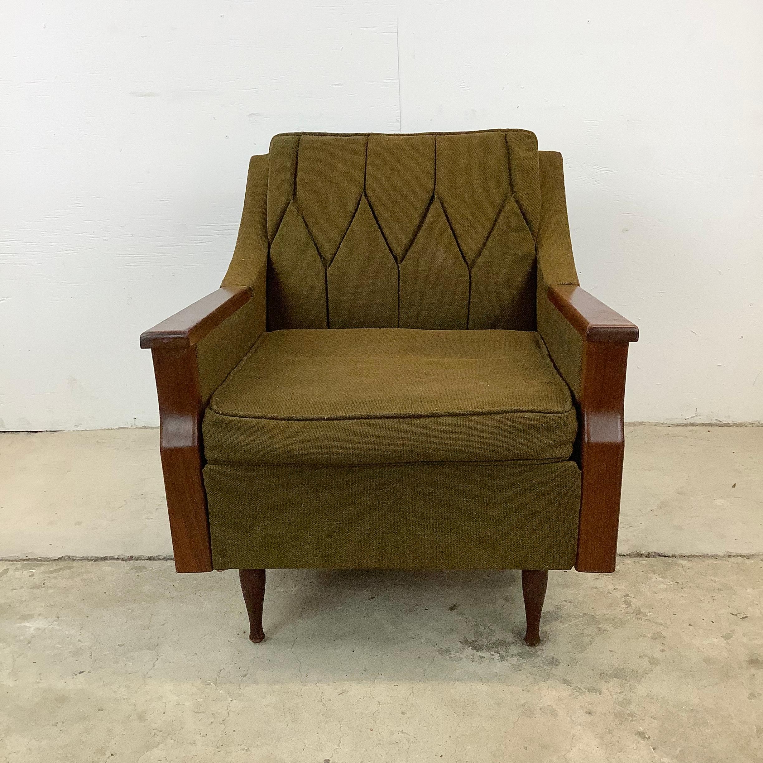 Discover the quintessential charm of mid-century modern design with this exquisite lounge chair, inviting you to sit back and relax in vintage elegance.

The chair is upholstered in vintage olive tweed fabric, which is believed to be the original