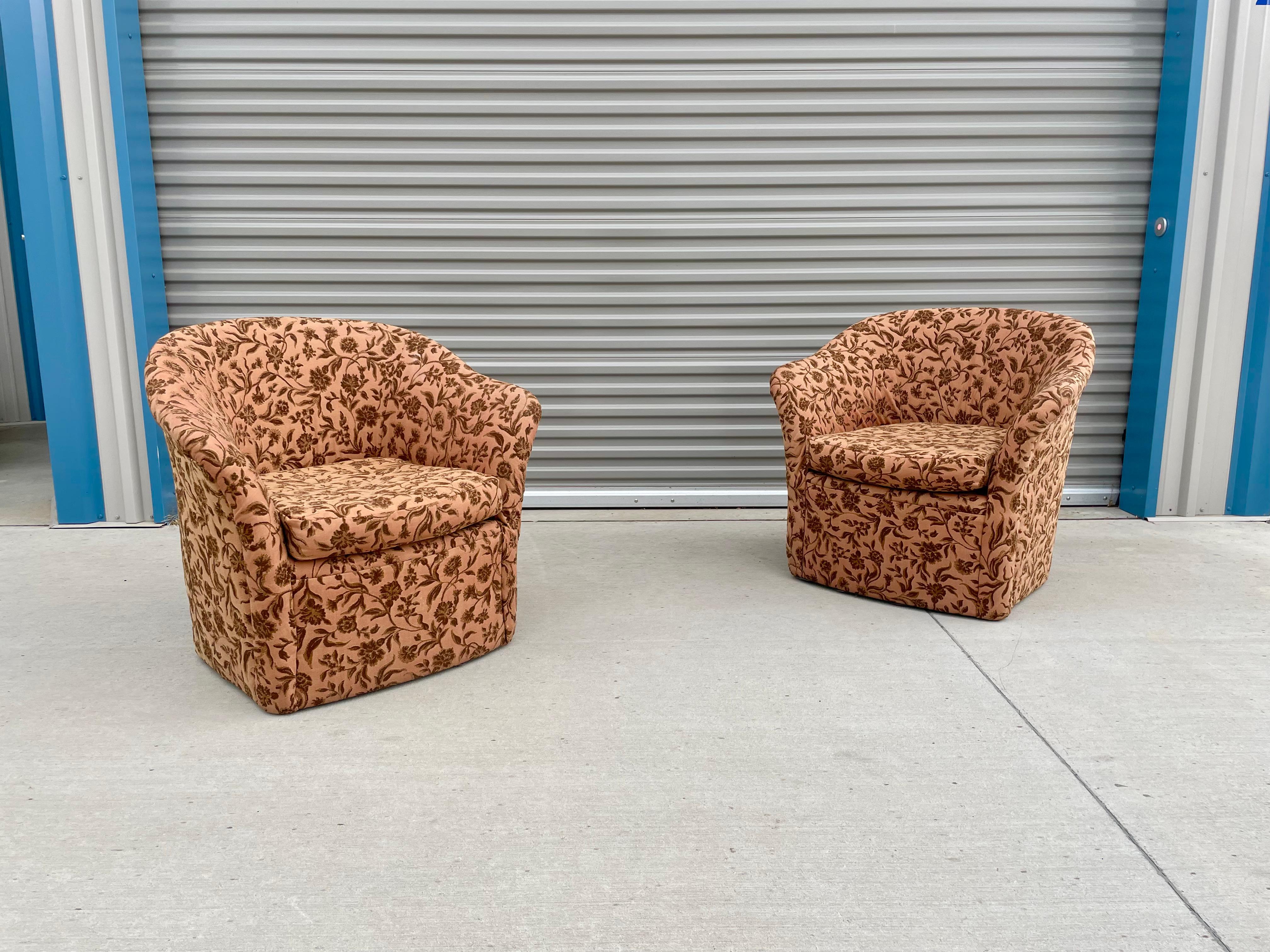 Beautiful mid-century modern lounge chairs designed and manufactured in the United States circa 1970s. These chairs feature a lovely flower-style upholstery giving them that vintage style while also making the chairs come together. The chairs also