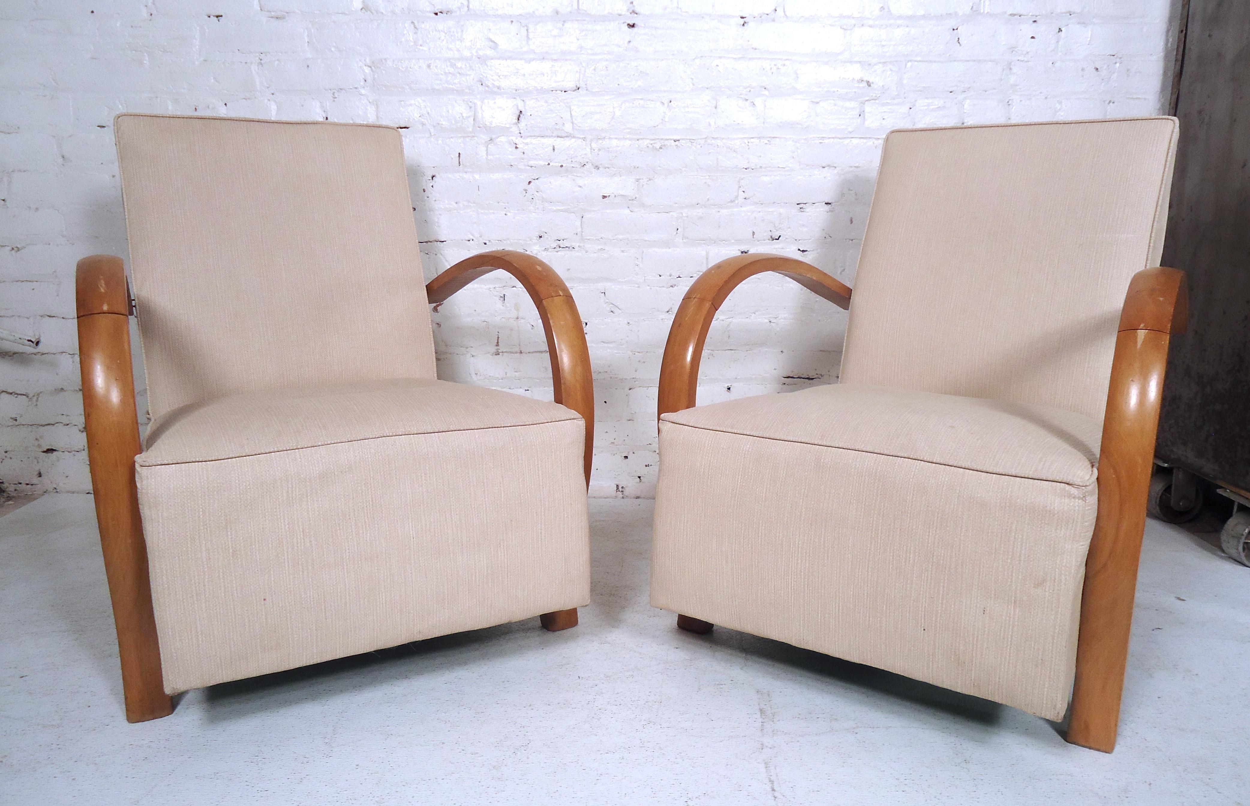 Elegant pair of vintage modern lounge chairs features stylish design and contemporary fabric. Comfortable seats make a unique addition to home or business seating arrangement. 

Please confirm item location (NY or NJ).