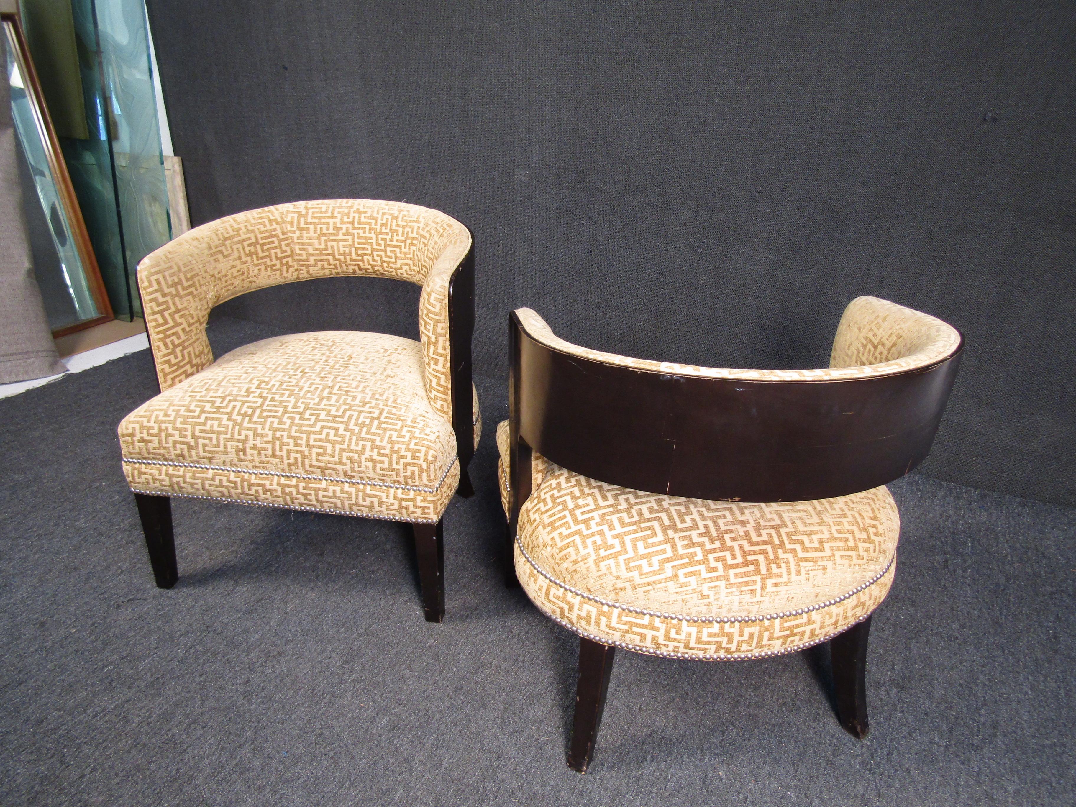 Unique mid-century lounge chairs with large swooping backs. Great fabric pattern with studded accents. 

(Please confirm item location - NY or NJ - with dealer).
 