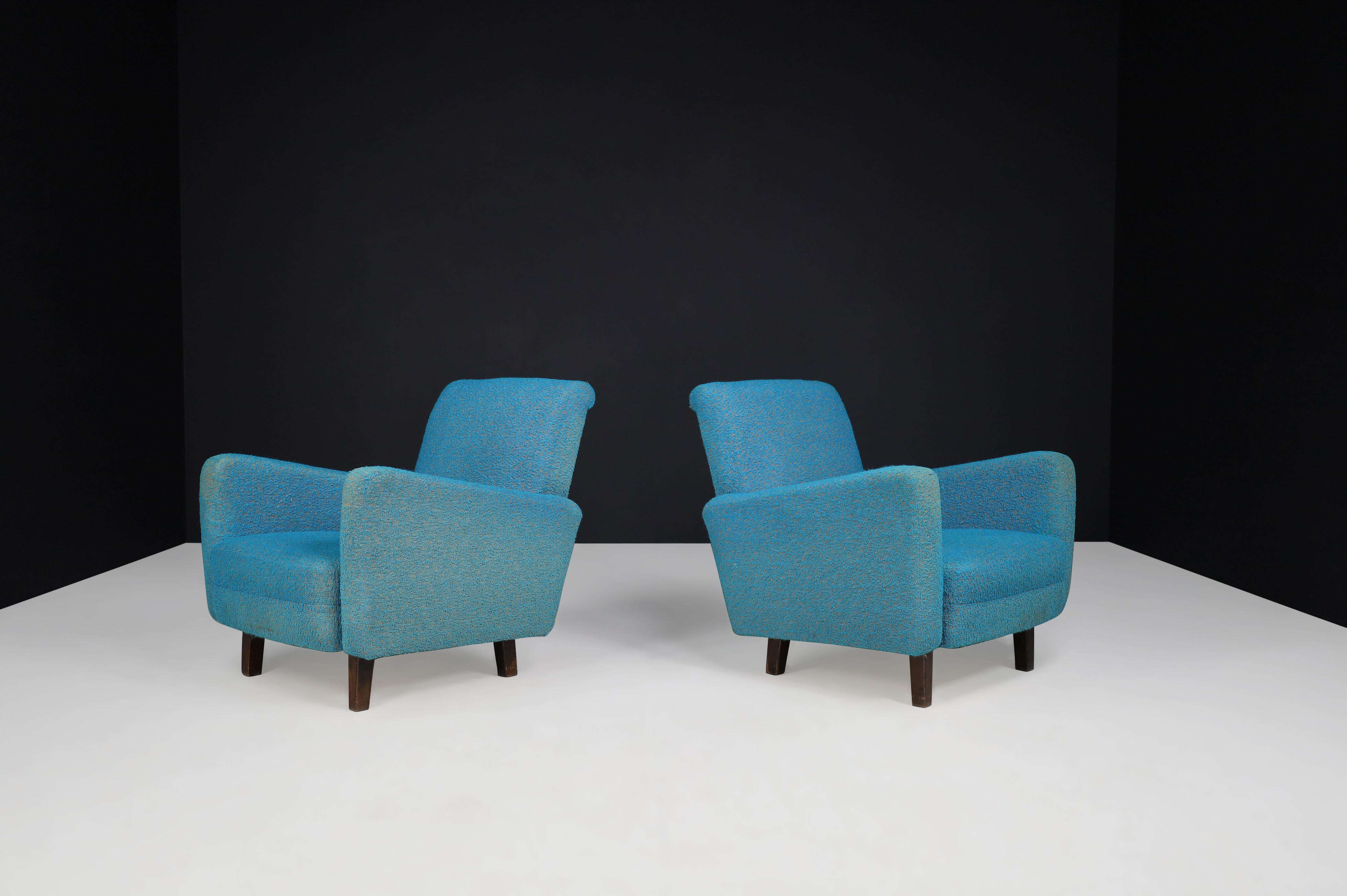 Mid-Century Modern Lounge Chairs in Original Upholstery, Praque 1950s 

Mid-Century Modern lounge chairs manufactured and designed in Praque 1950s. Their refined lines, armrests, and seating give these armchairs a characteristic, visually exciting