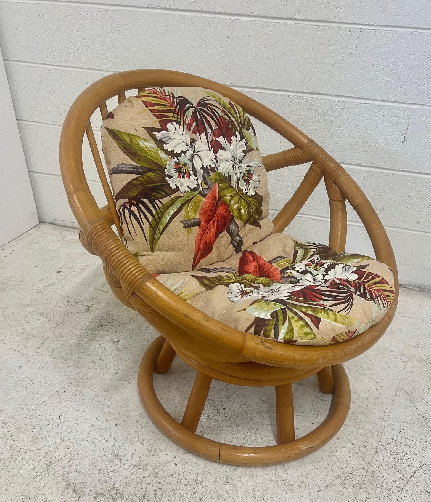 Mid century modern bamboo rattan lounge hoop chair for sun room. Made by Beverly Hills. Part of a larger set. Very good condition. Unrestored. Some wear from normal use. Cushions recently upholstered. Does not swivel.

Dimensions: 30.5