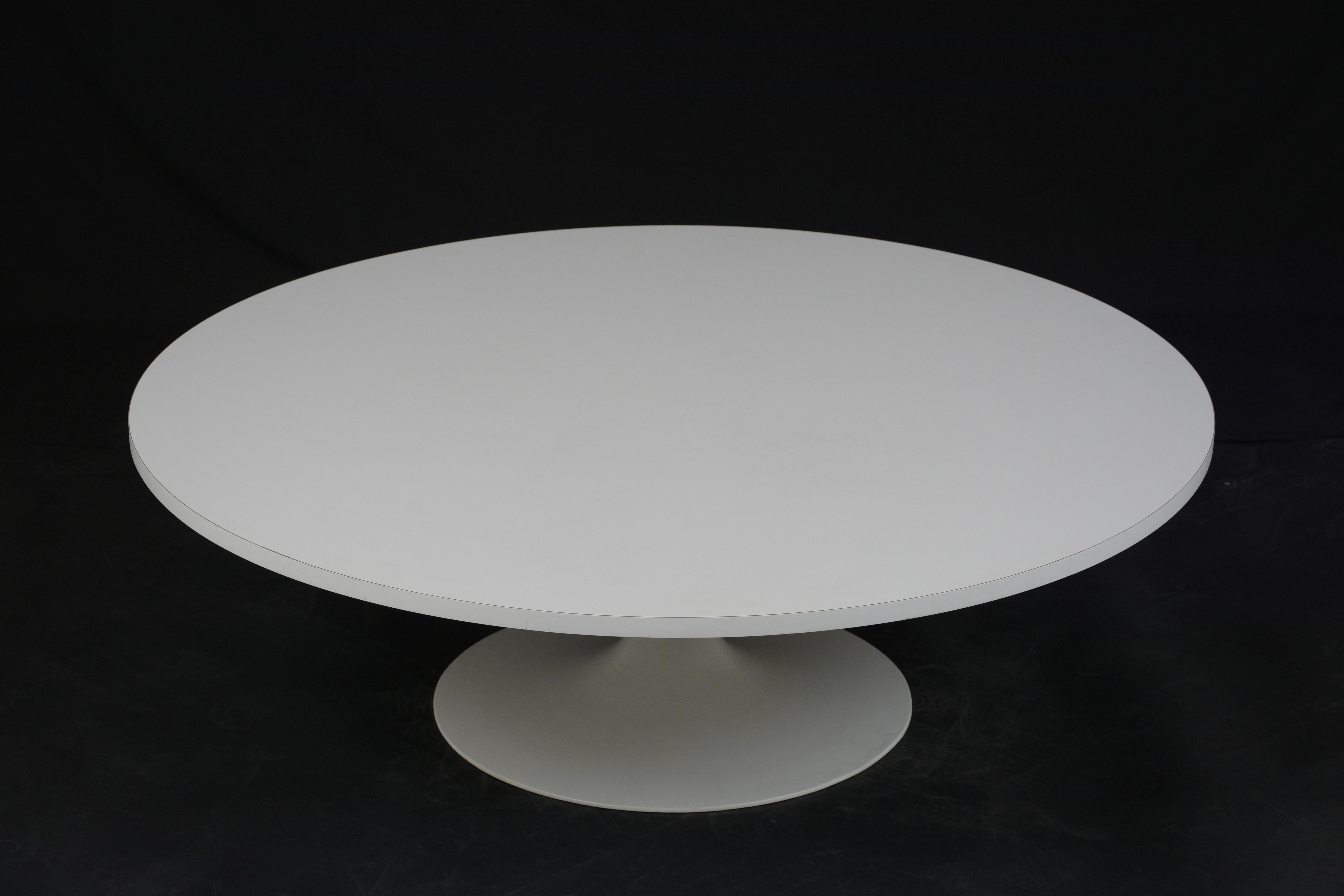 This 1960s Mid-Century Modern coffee table or cocktail table features a Formica covered wood top with a metal base. The table is finished in a Stark white color that will stand out in any room. This coffee table is sturdy, sleek, and ready to be