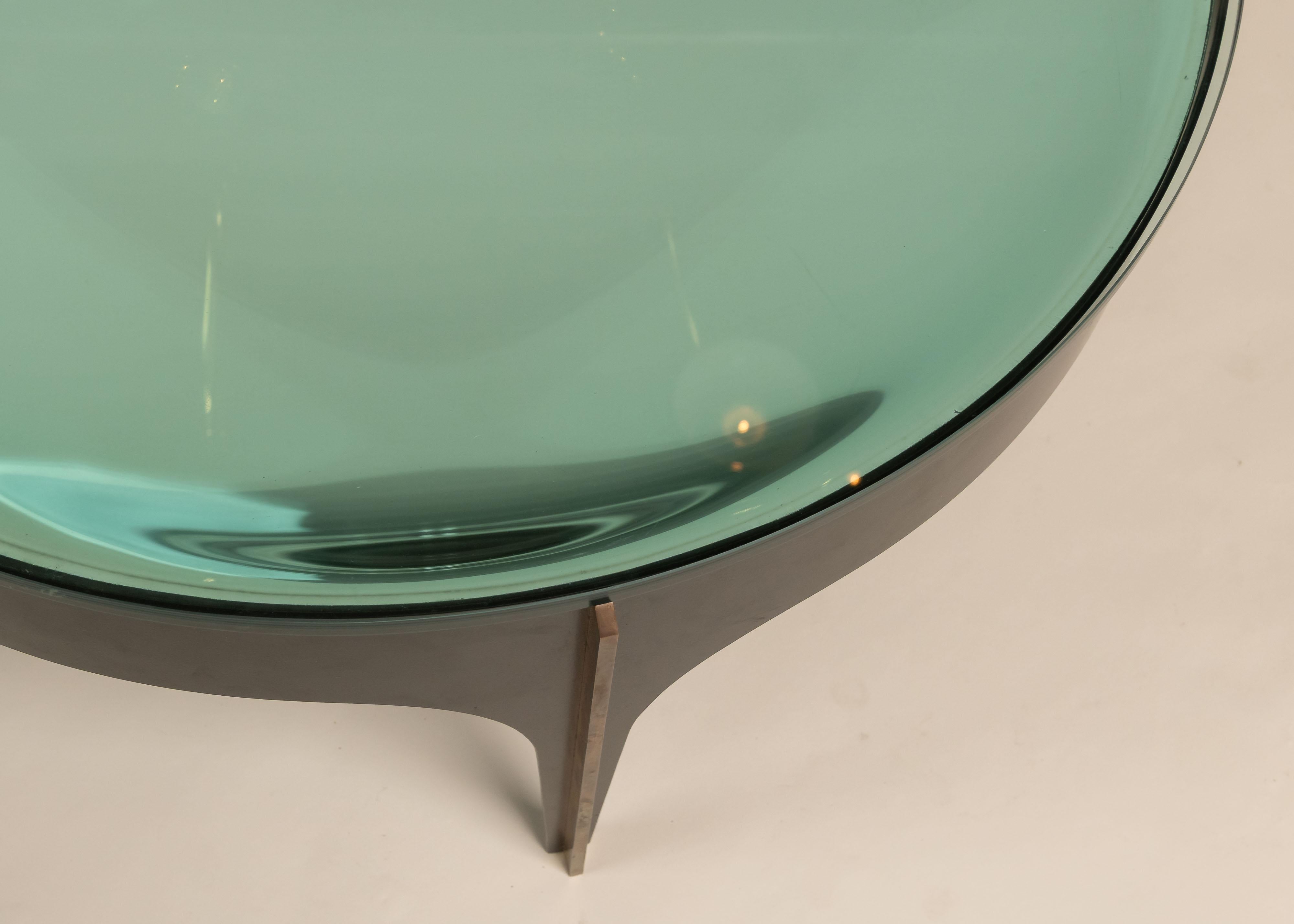 
Low Coffee Table, Model 1774, designed by Max Ingrand for Fontana Arte, Italy, circa 1958. The sculptural base is made from curved blackened iron with solid brass trim at the legs. The top is built in two parts: a profiled ultra-clear Murano glass