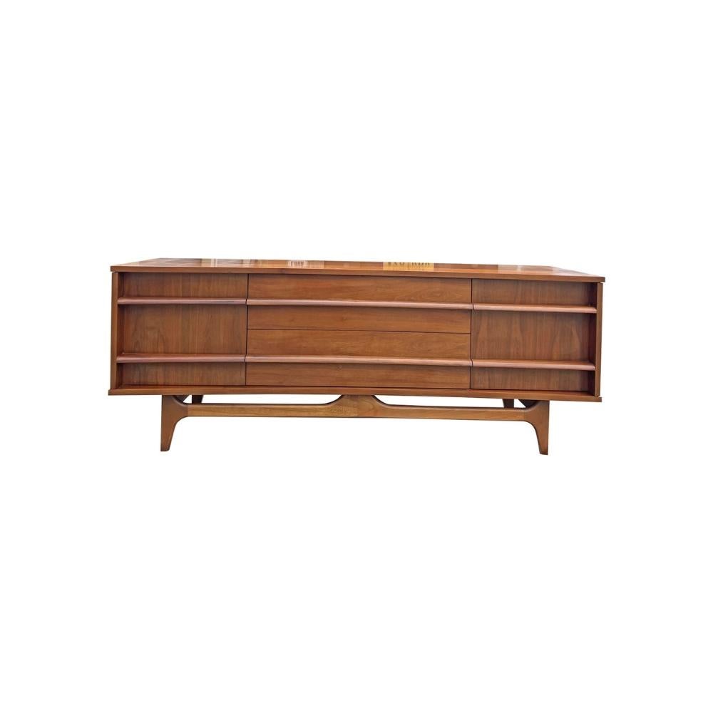 Mid Century Modern Low Concave Compact Credenza Cabinet by Young and Company!

This Mid-Century Modern credenza by Young and Company features a sleek and distinctive design, with the front curving slightly to create a striking concave look.