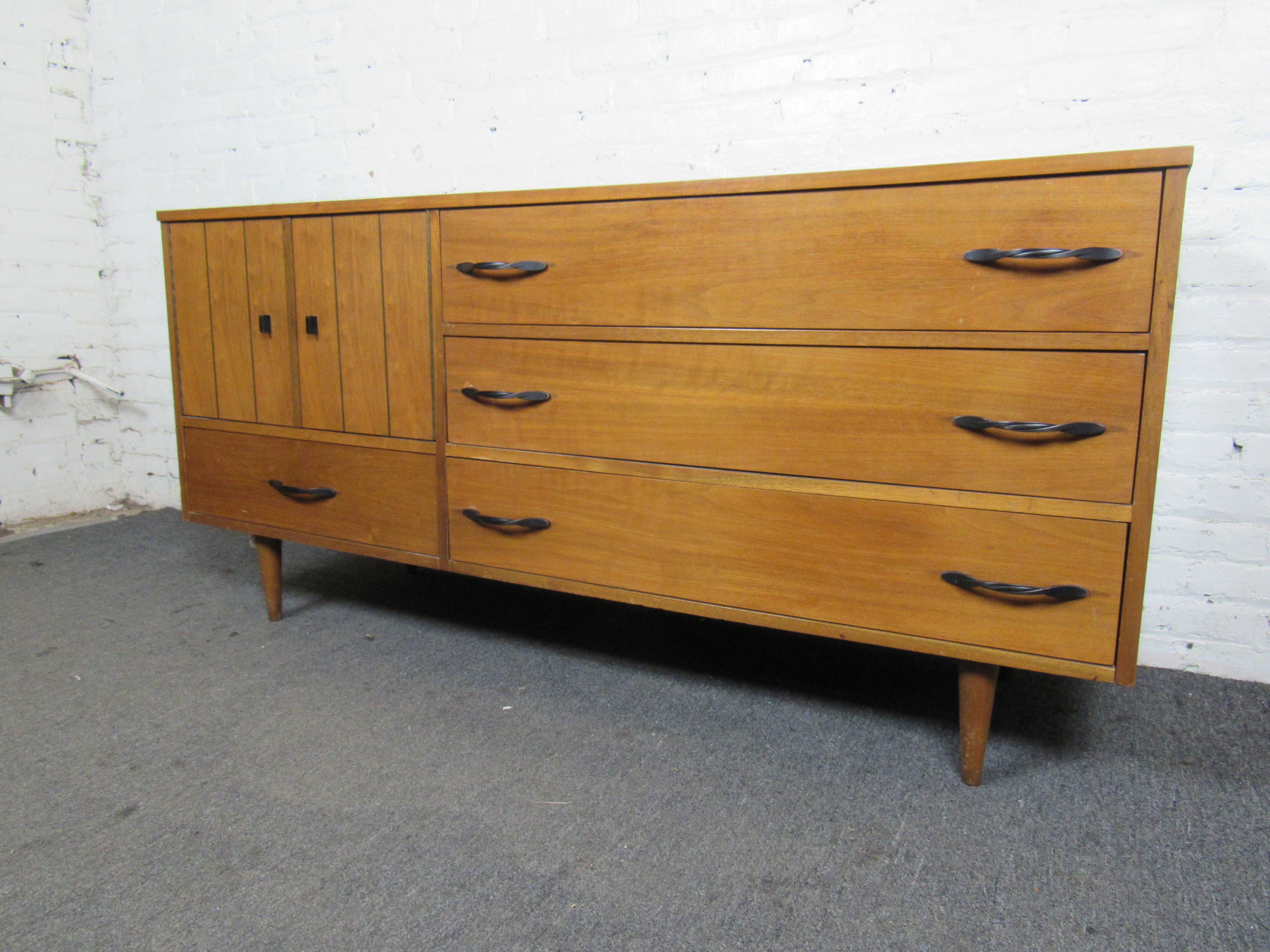 With three wide drawers and two separate storage compartments, this vintage low dresser is great for adding Mid-Century style to any bedroom. Please confirm item location with seller (NY/NJ).