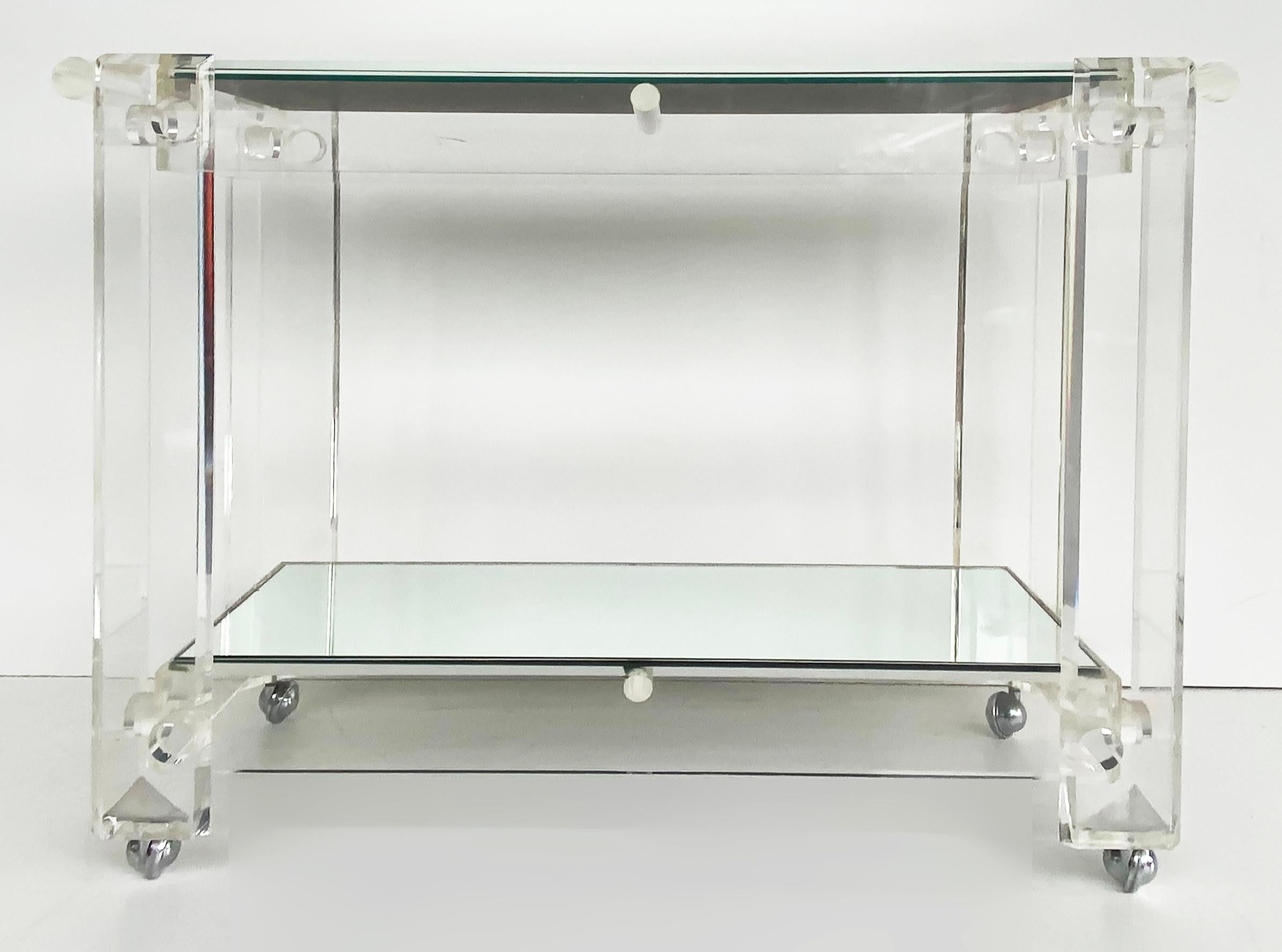 Mid-century Modern Lucite 2-Tiered Serving/Bar/Tea Cart on Casters

Offered for sale is a mid-century modern lucite two-tiered serving/bar/tea cart on casters and with mirrored shelves. The cart has a sturdy Lucite push handle at one end and will