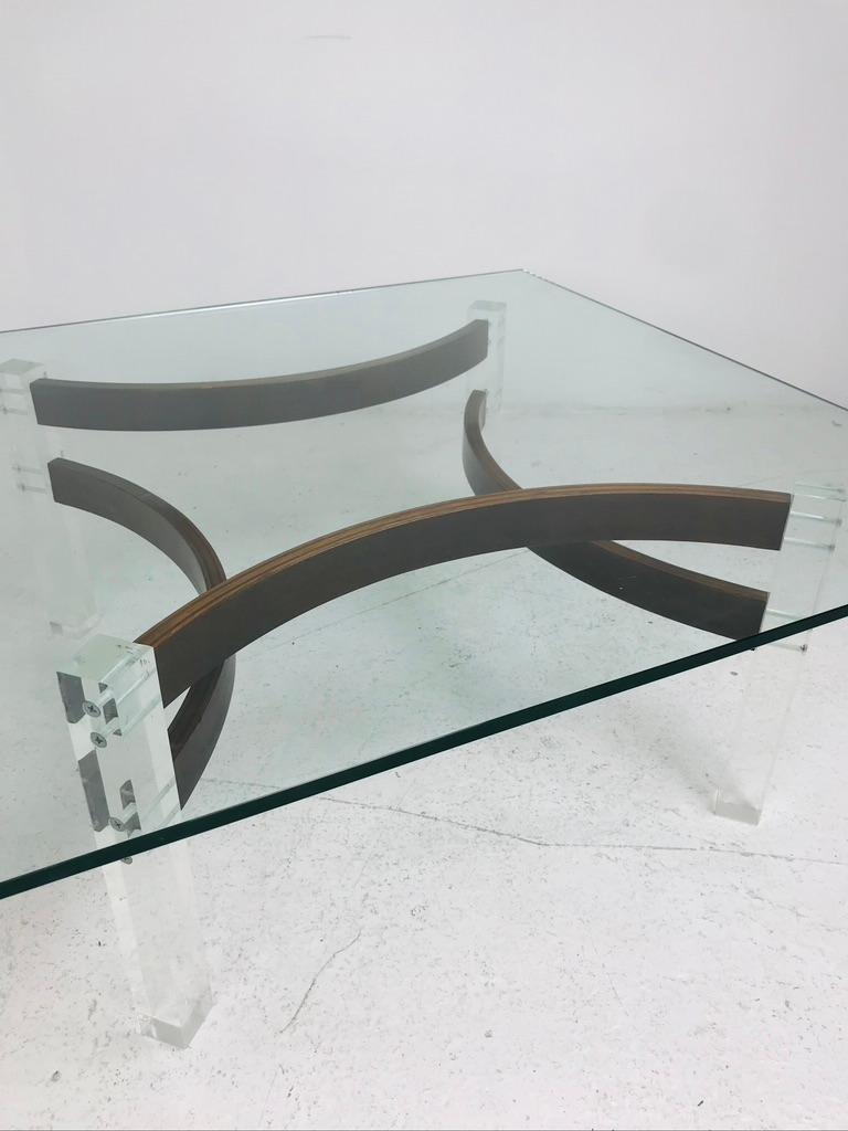 Rare bentwood and lucite 1970s coffee table. Lucite legs, walnut frame, glass top.