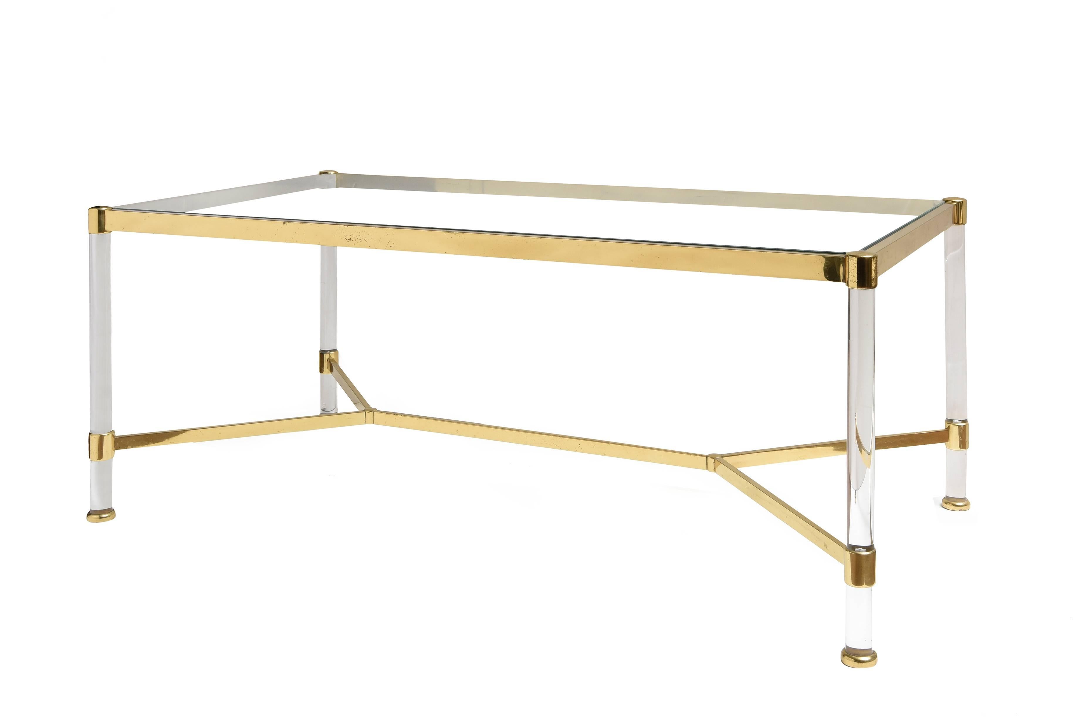 Mid-Century Modern Lucite and brass coffee table.
