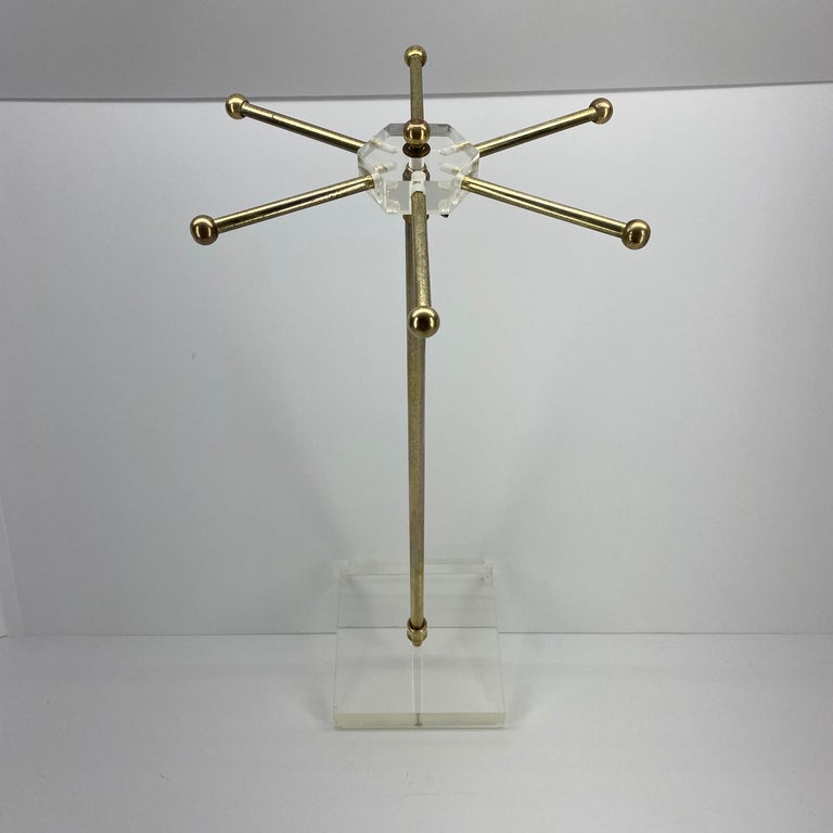 Mid-Century Modern Lucite tie and jewelry stand

This tie rack has a worn brass finish, please see attached images for details.

  