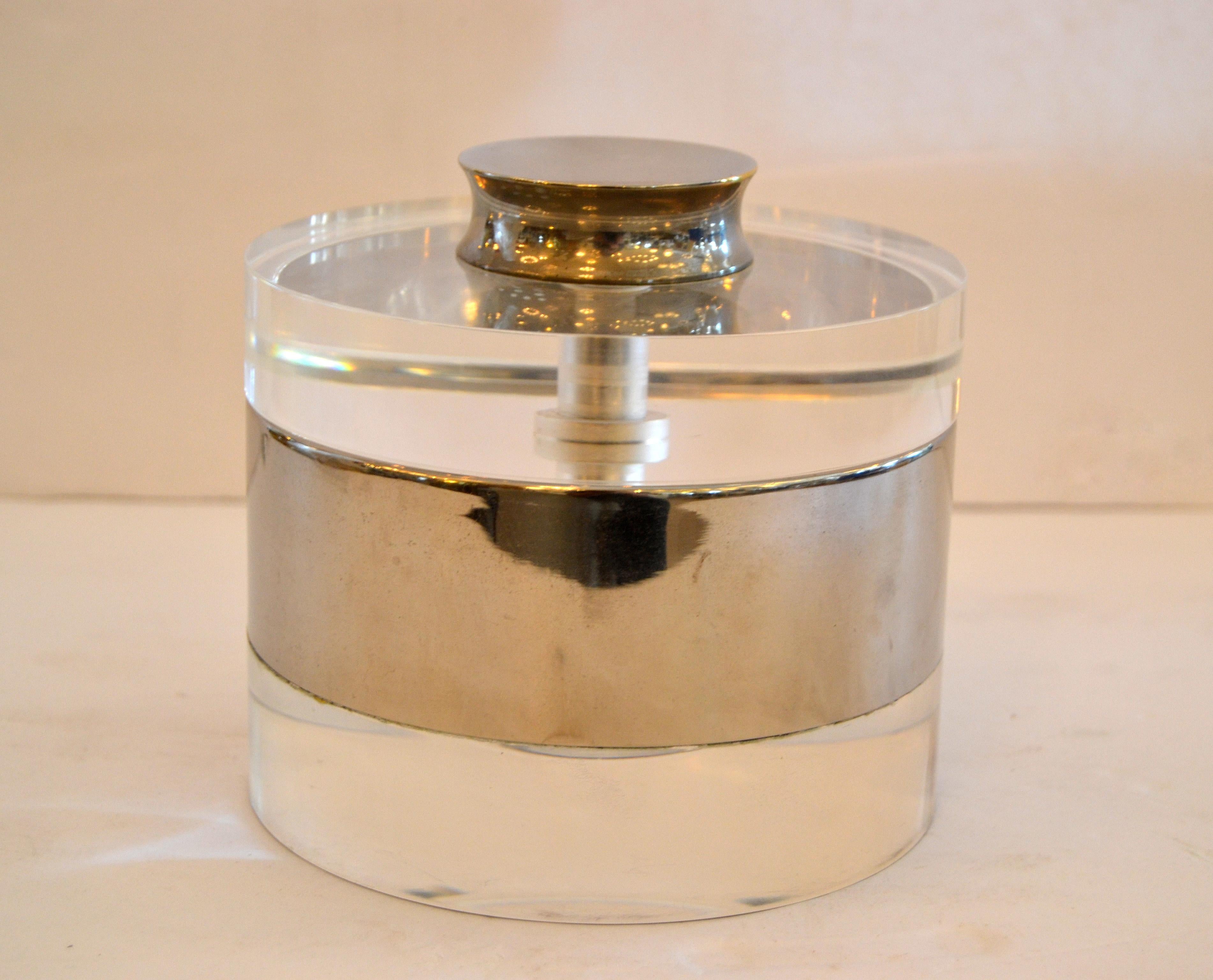Mid-Century Modern Lucite and chrome ice bucket or candy dish.
The Lucite is thick and very well crafted.
Condition note: Some sporadic crackling in the Lucite, especially to the inside of the bottom.