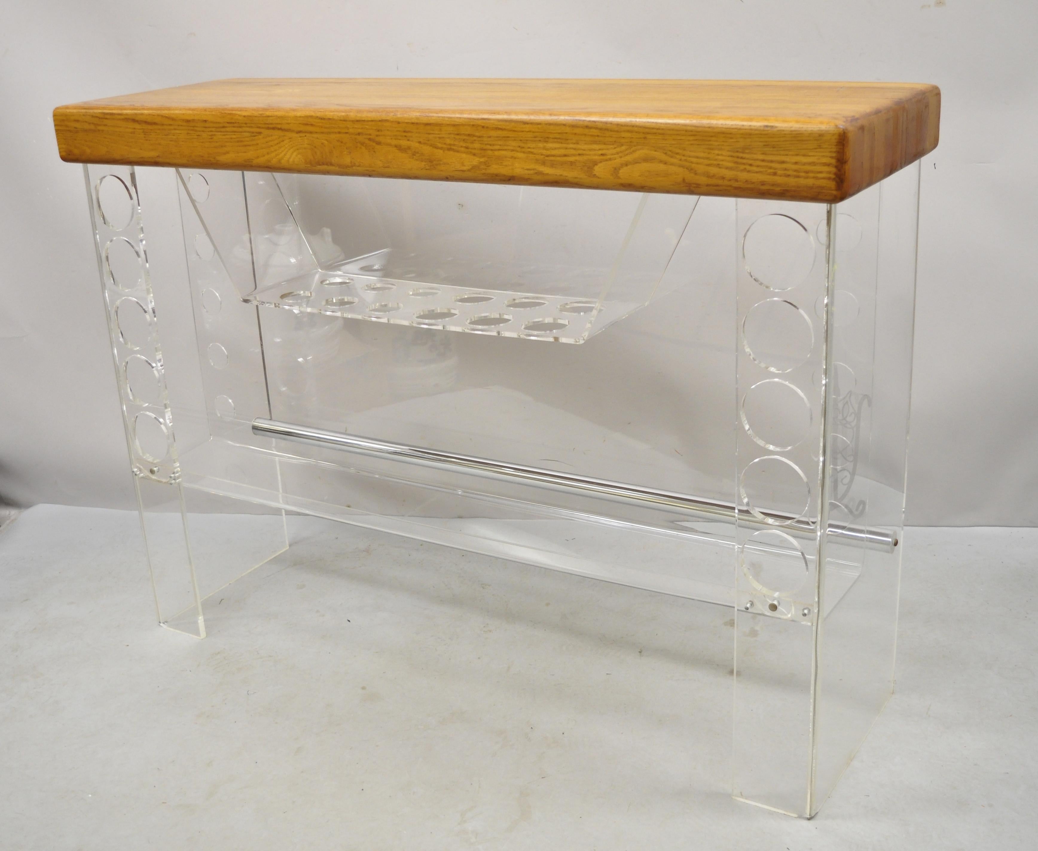 Mid Century Modern Lucite and Oak Wood Butcher Block Top Wine Bar. Item features. Thick butcher block wooden top, lucite base, wine bottle holders to base, very nice vintage item, great style and form, attributed to Luigi Bardini for Hill Mfg. Circa