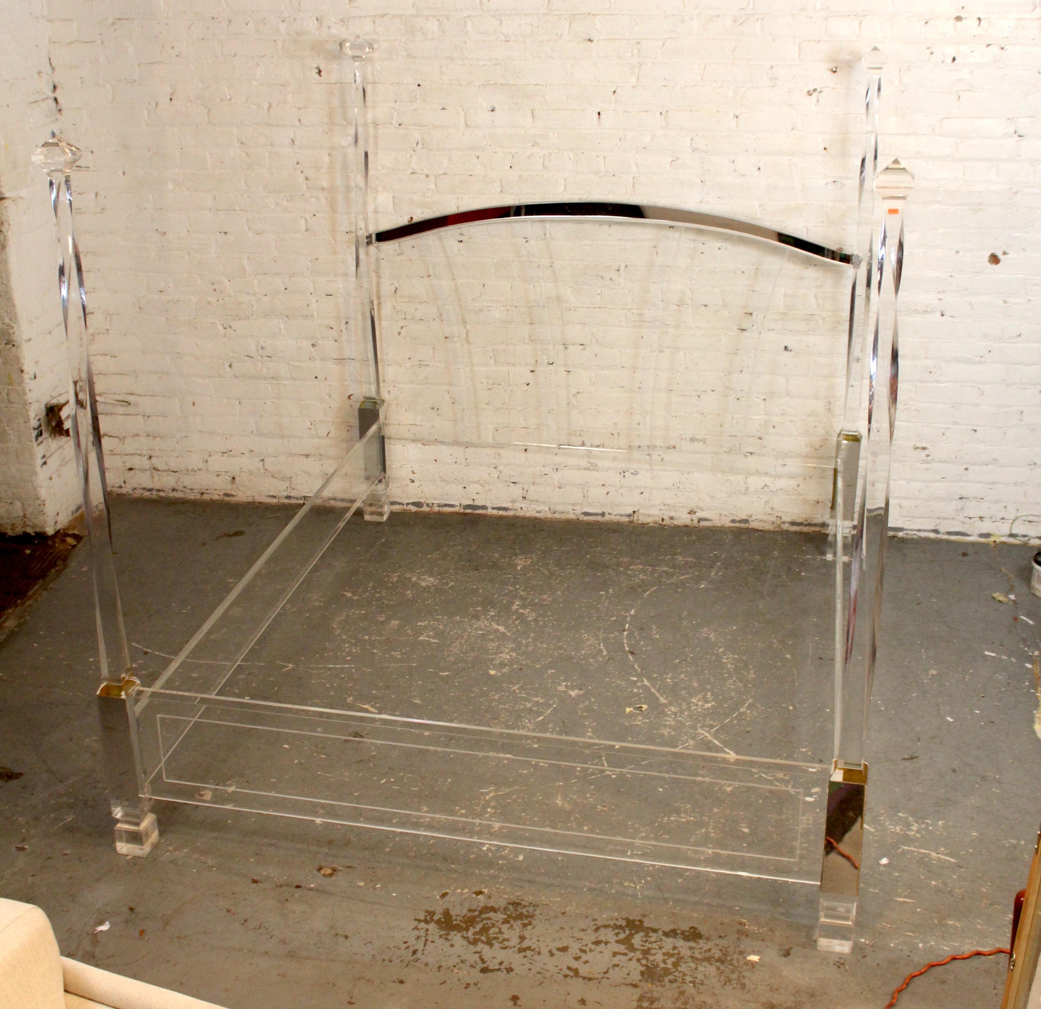 Striking and sculptural, this vintage Lucite four-poster bed is a glamorous centerpiece in the style of Charles Hollis Jones. The transparent frame adds visual lightness while delivering a bold, luxurious statement.

Please confirm pickup location