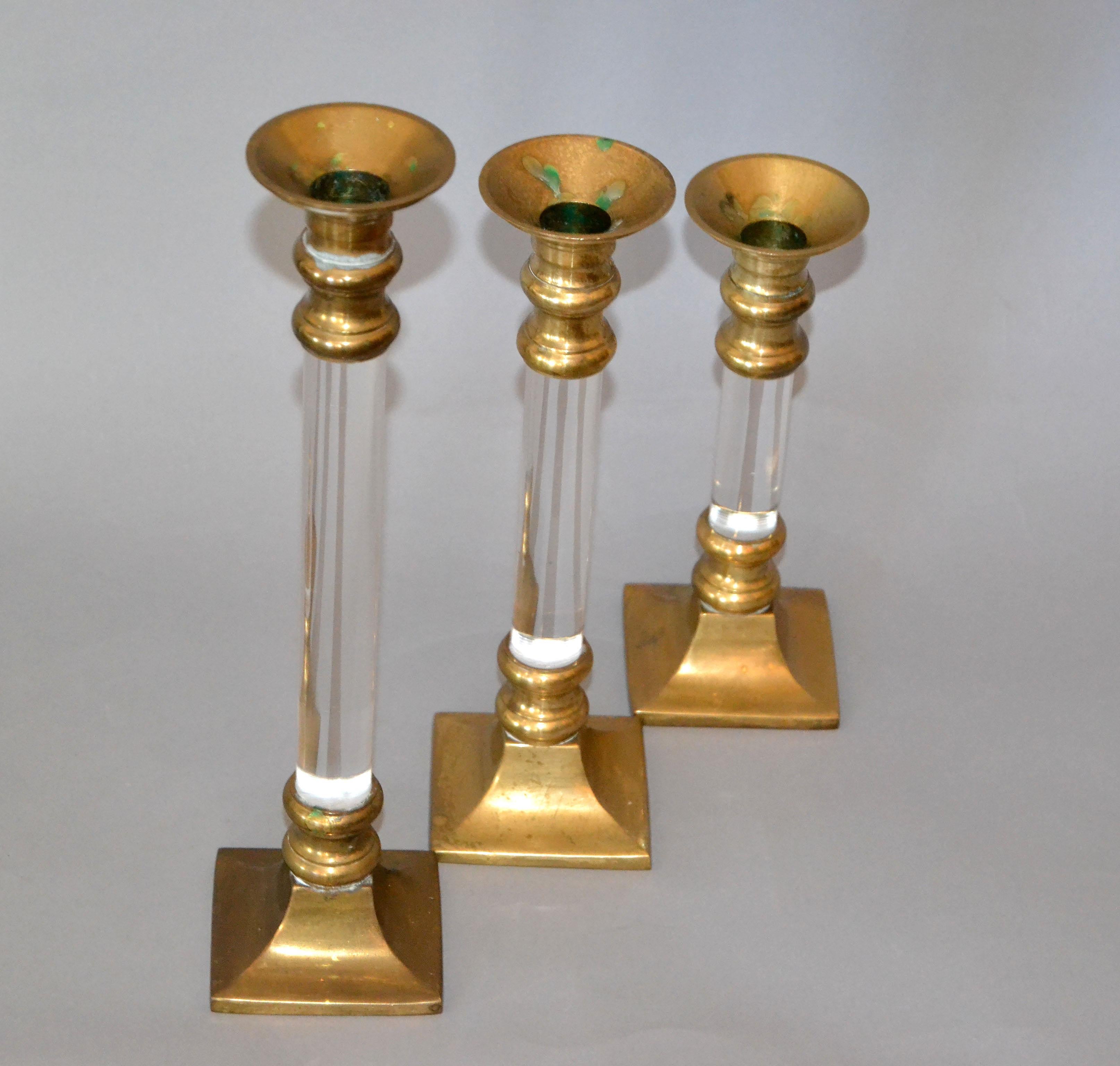 Set of three Mid-Century Modern Lucite and brass candle holders or candlesticks.
The set is very old and we intentionally left the brass in its original condition.
They come in three sizes: 12-10-8 inches height.