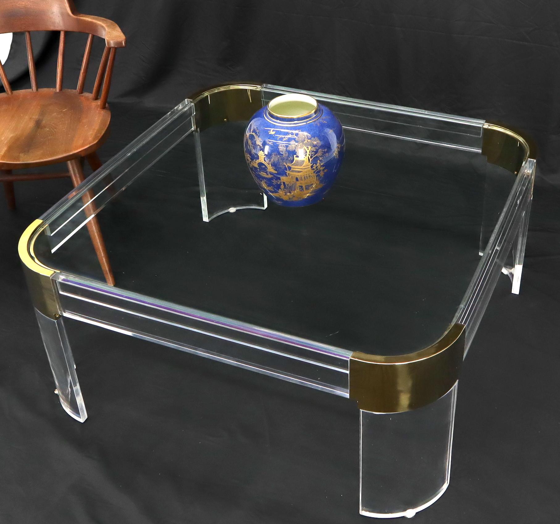 Mid-Century Modern rounded corners brass lucite and glass coffee table.