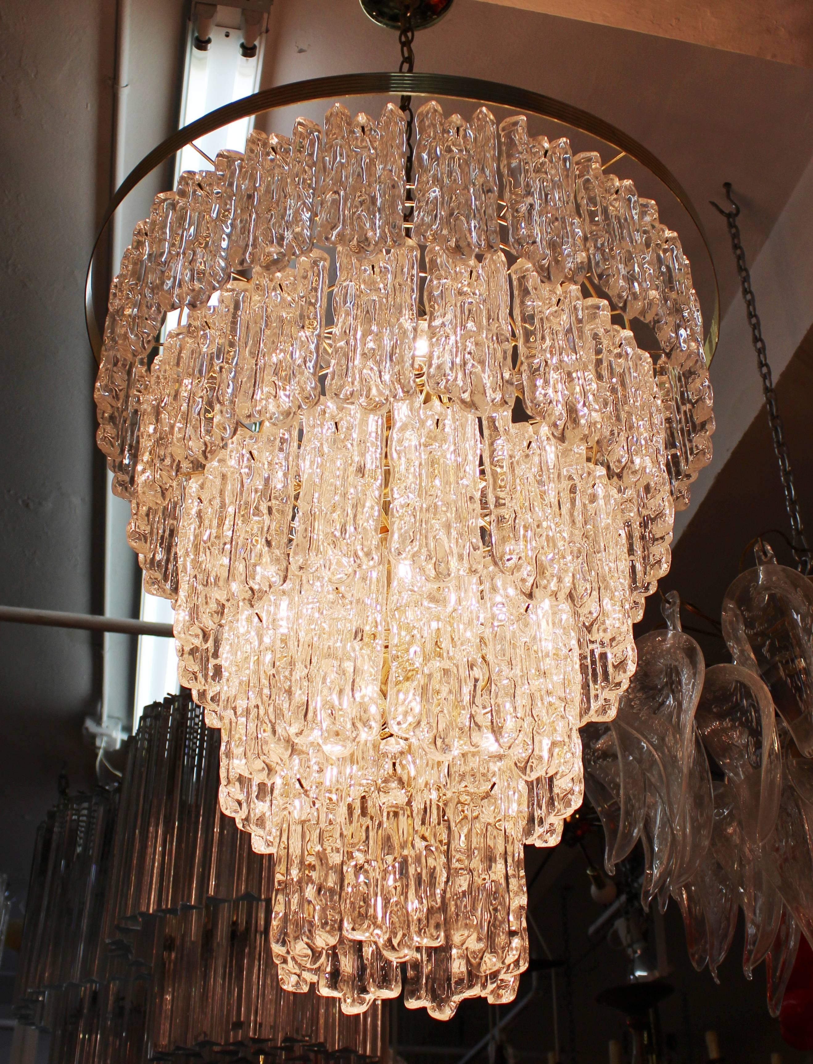 A Mid-Century Modern multi-tiered chandelier with Lucite elements on a metal frame. The piece has recently been rewired for US standards and is in great vintage condition.
