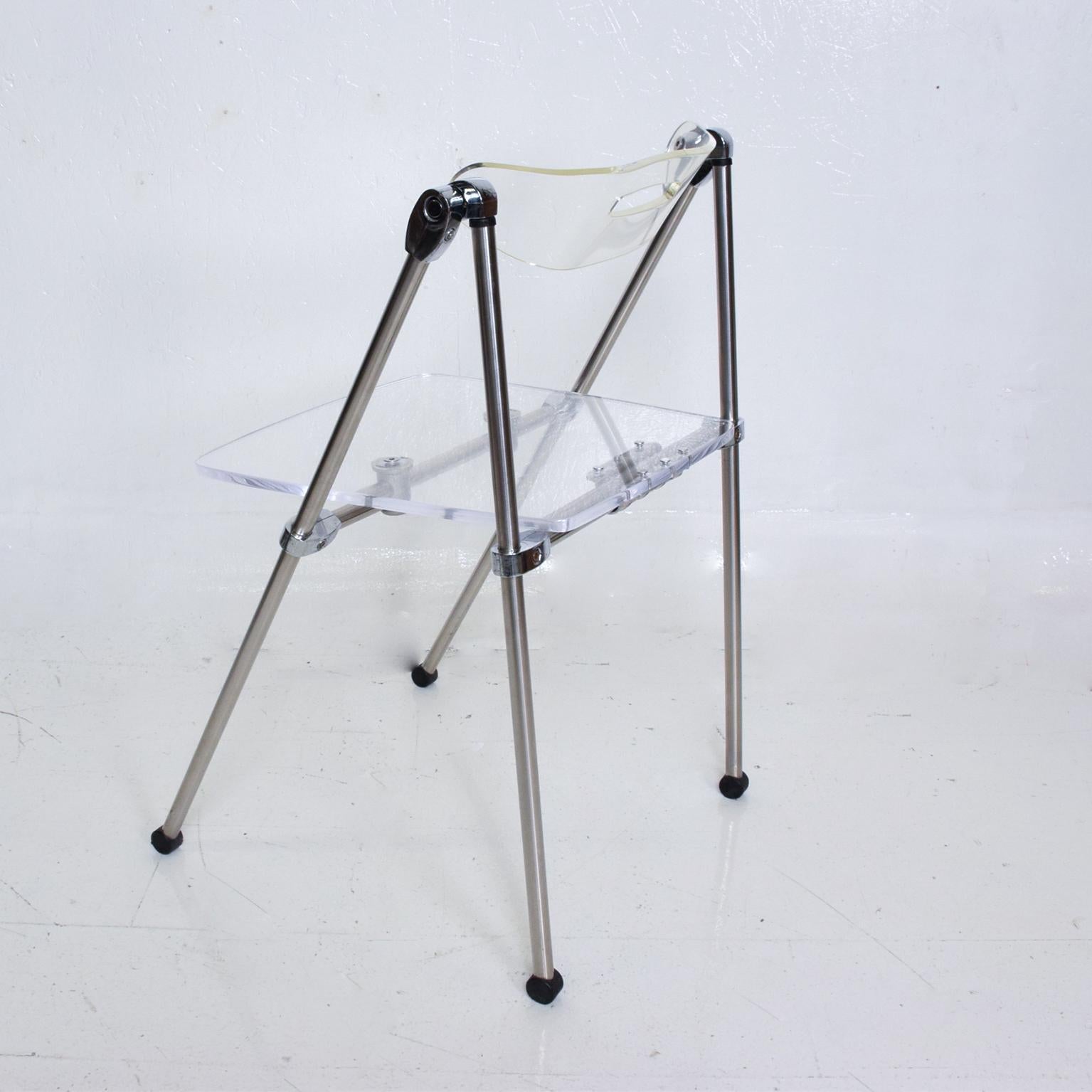 For your consideration, a single occasional Lucite Chair, After Giancarlo Piretti, Castelli. The Original seat was replaced with a new lucite seat and aluminum support. Backrest has a stress fracture. Refer to images. No label present from the