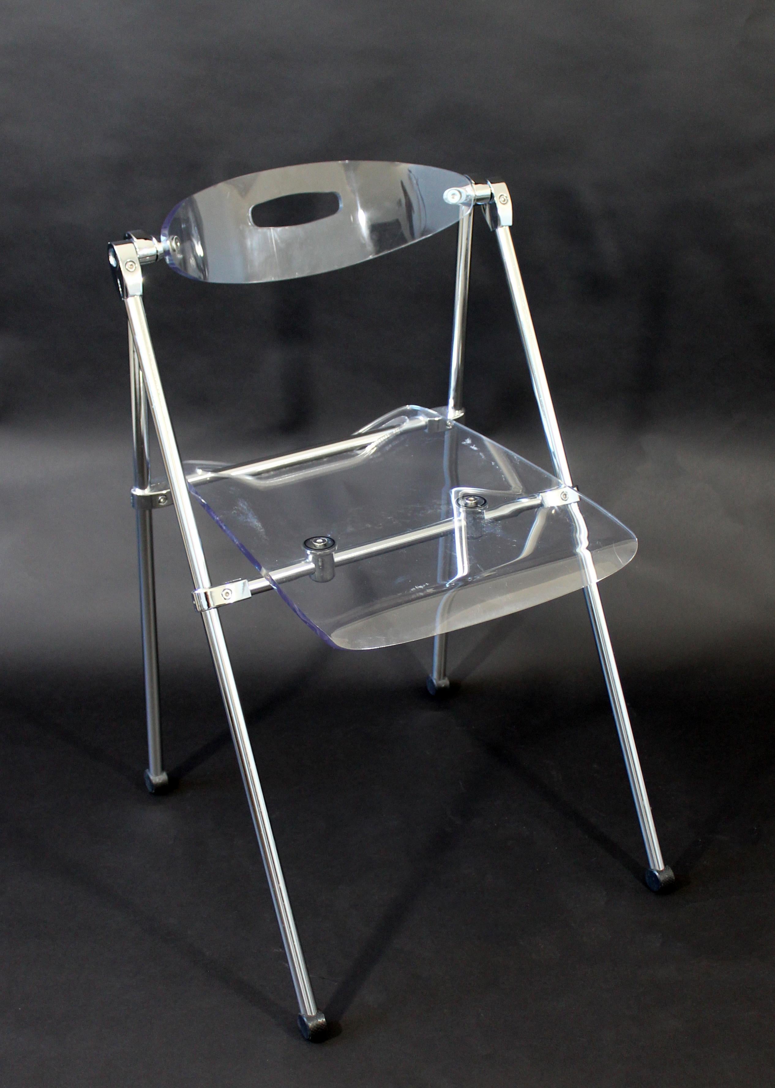 For your consideration is a neat folding side chair, made of chrome and Lucite, in the style of Castelli, circa 1960s. In very good vintage condition. The dimensions are 20