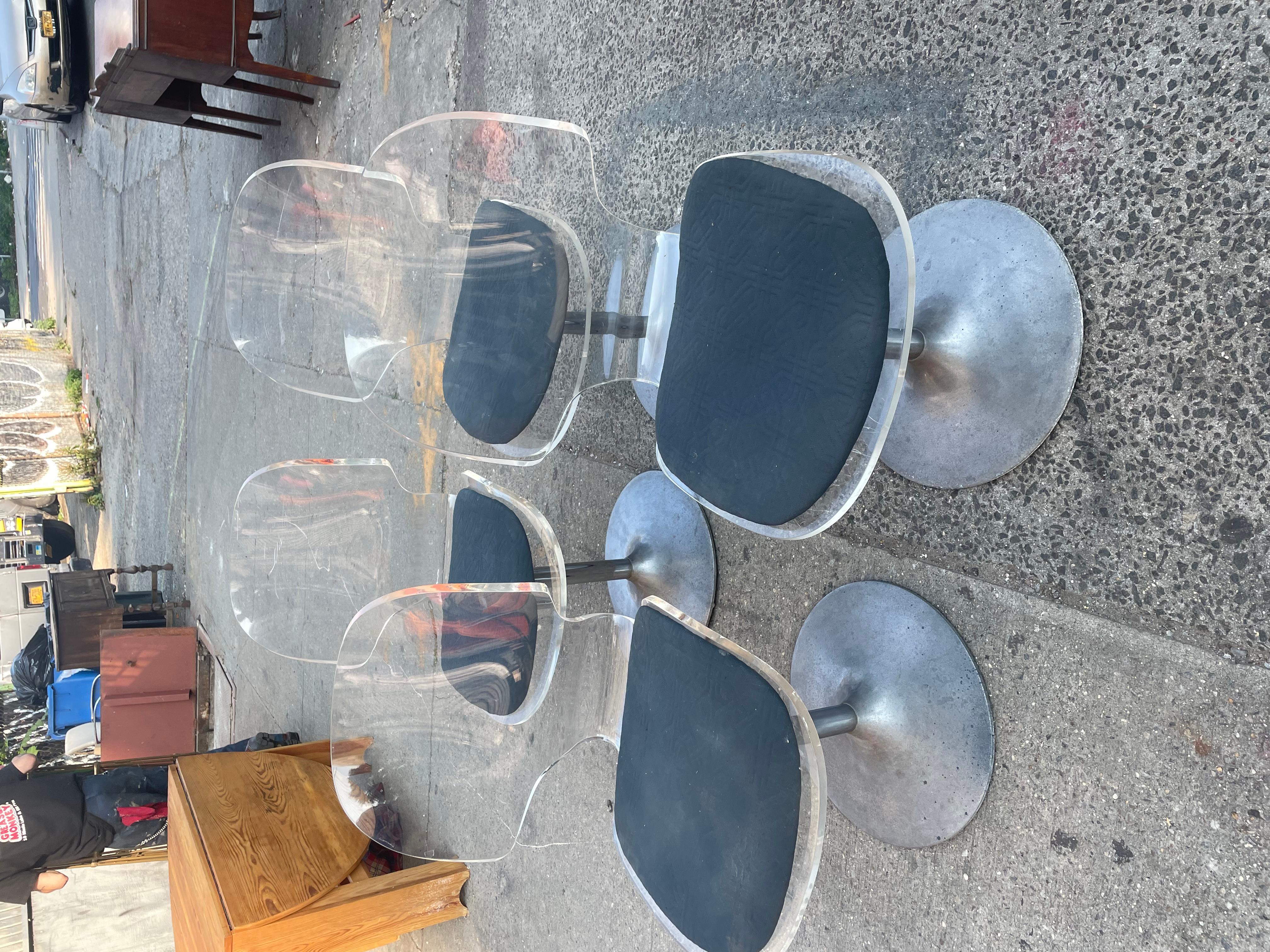 Beautiful set of 4 
Mid century modern
Clear lucite dining chairs
On aluminum bases
With grey cushioned seat cushions
Great for any retro dining table set
