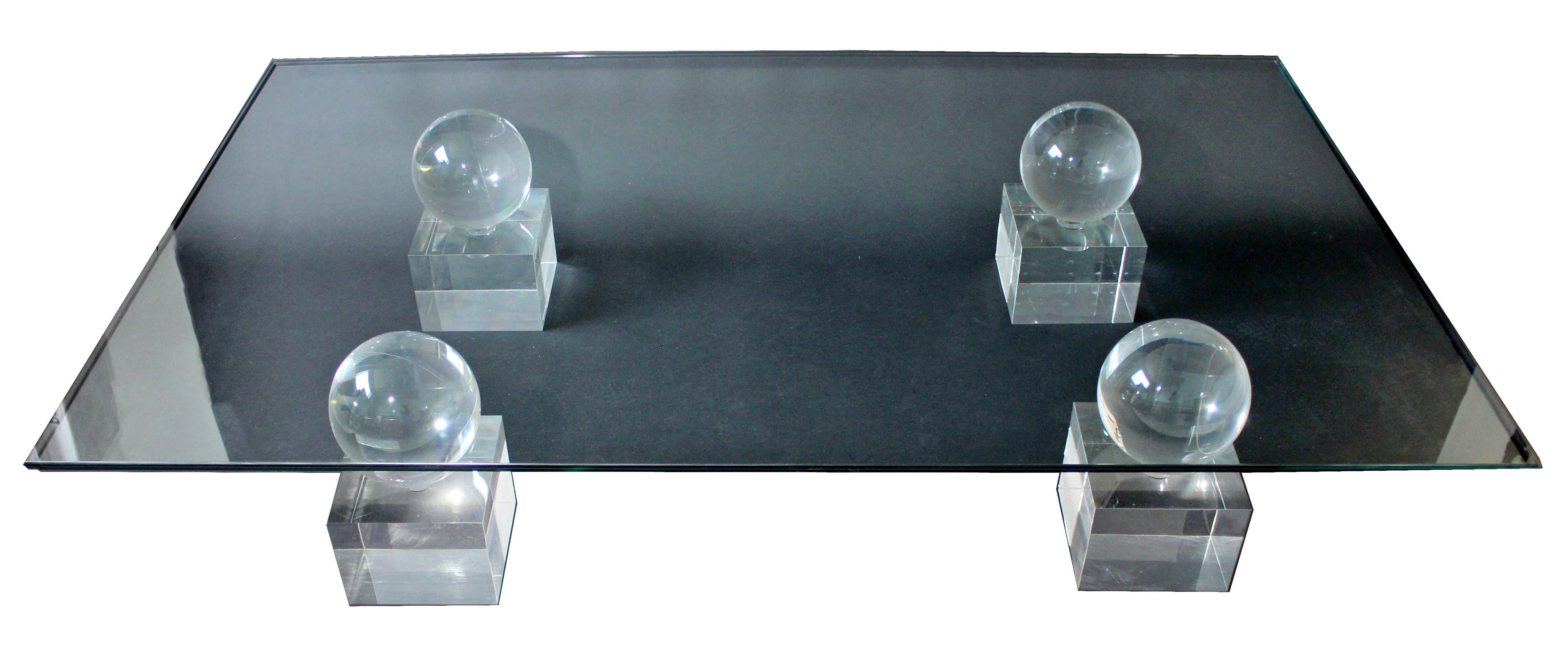 For your consideration is an incredibly lux, large, rectangular coffee table, made of glass and with Lucite bases, by Comatec, France, circa 1970s. In excellent condition. The dimensions are 66