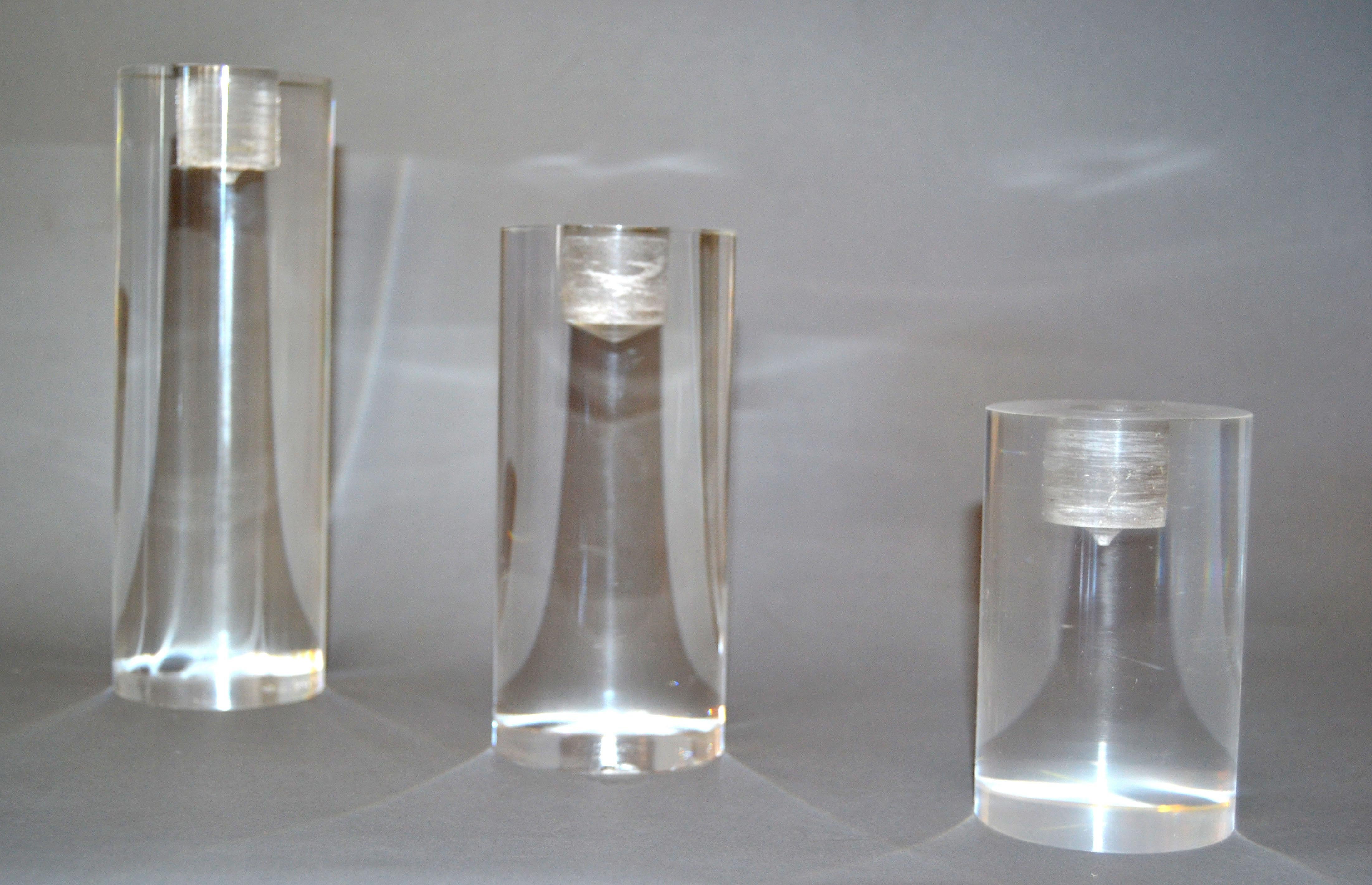Set of three Mid-Century Modern Lucite candleholders in graduated sizes.
Large, 7.38 inches height x 2.5 inches diameter.
Medium, 5.63 inches height x 2.5 inches diameter.
Small, 4.00 inches height x 2.5 inches diameter.
Designed to fit any