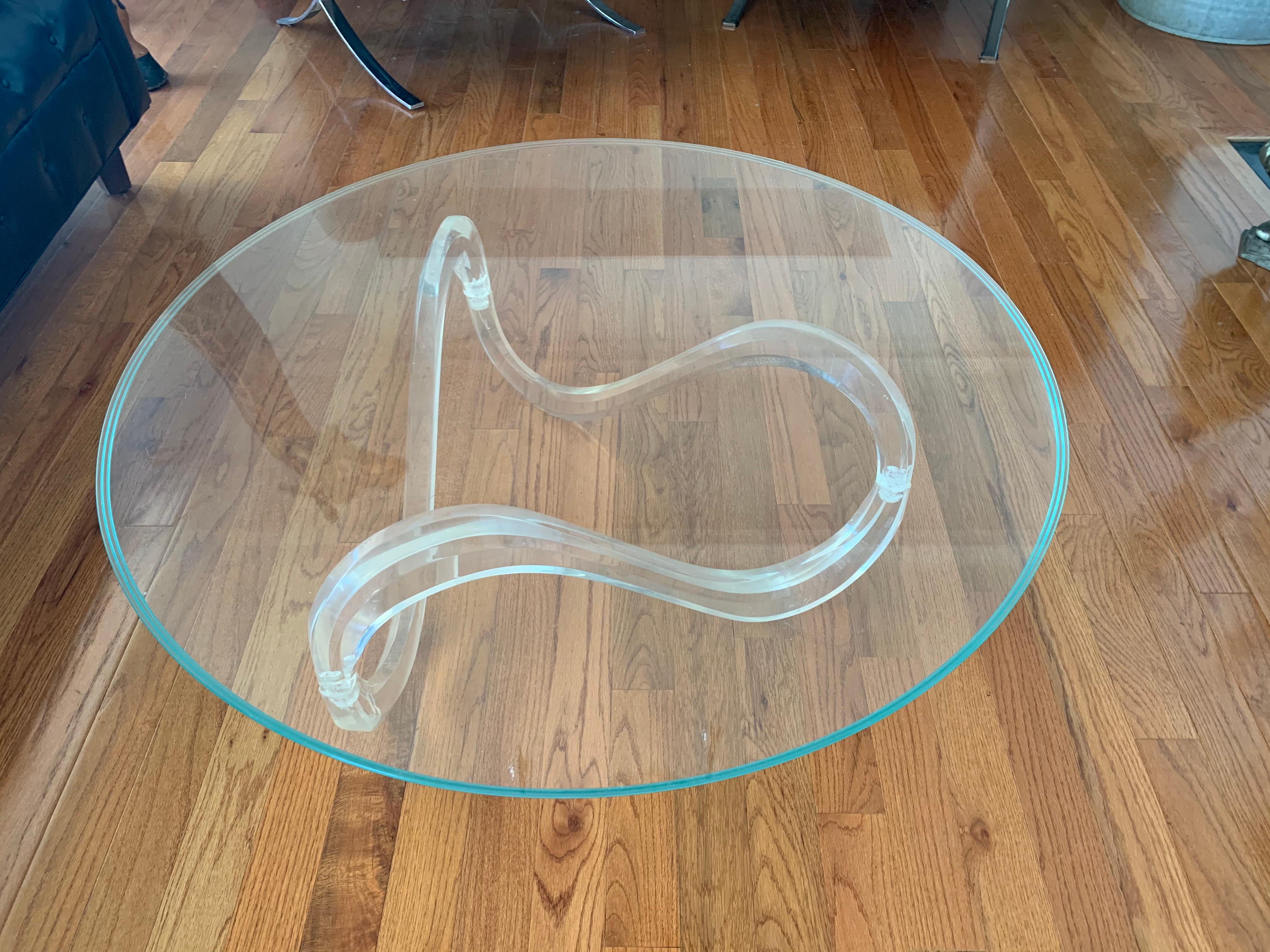 Stunning midcentury cocktail table with heavy, thick glass top and sculptural Lucite base. Great scale and better lines. Now more than ever, home is where the heart is.
