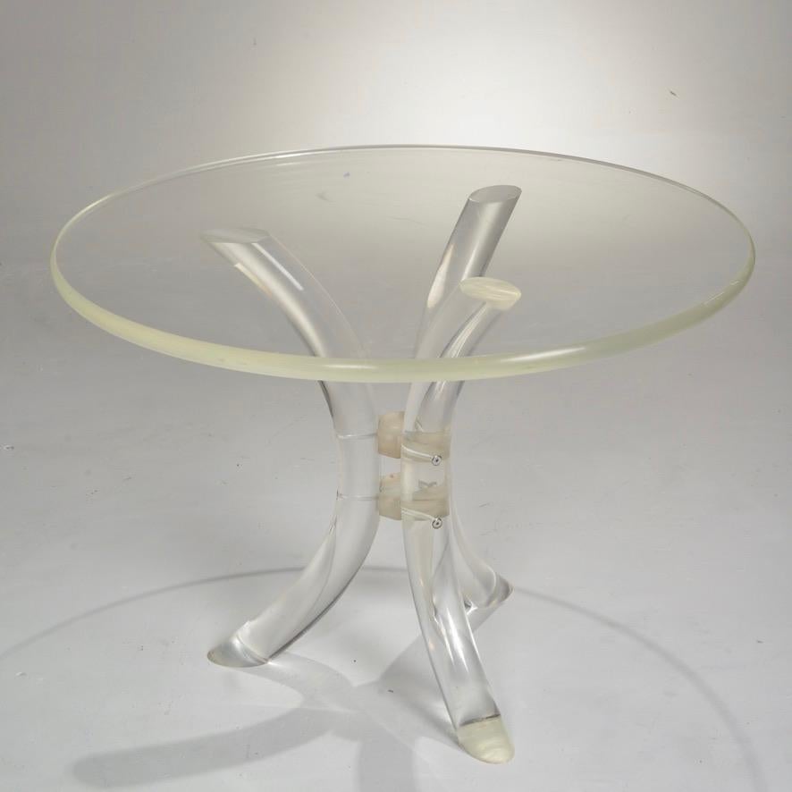 Beautiful Mid-Century Modern Lucite side or occasional table with curved tripod legs and thick round top. Top has moderate wear.  



 
 