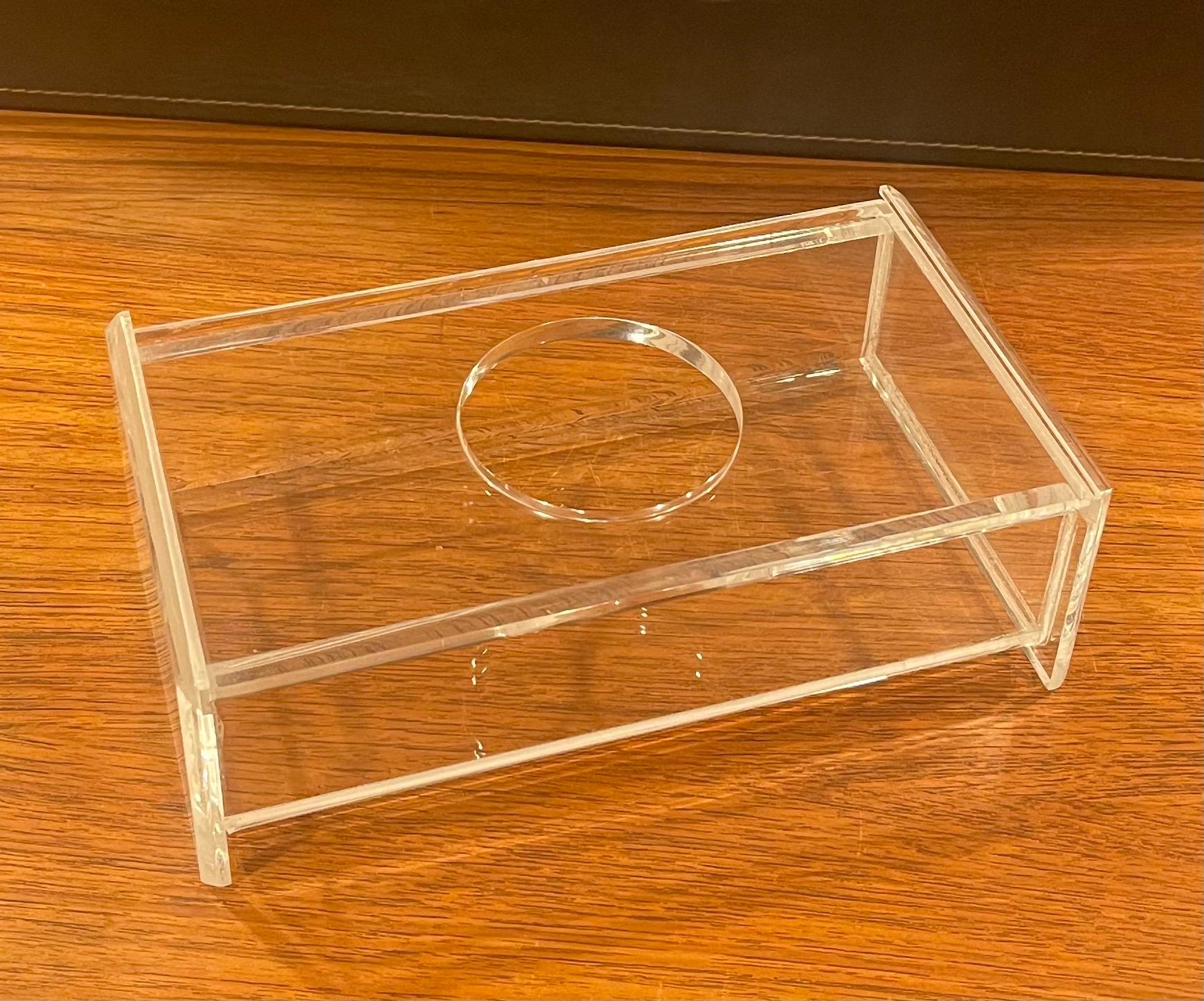 Mid-Century Modern lucite tissue box in the style of Charles Hollis Jones, circa 1970s. The piece is in very good vintage condition and measures 10