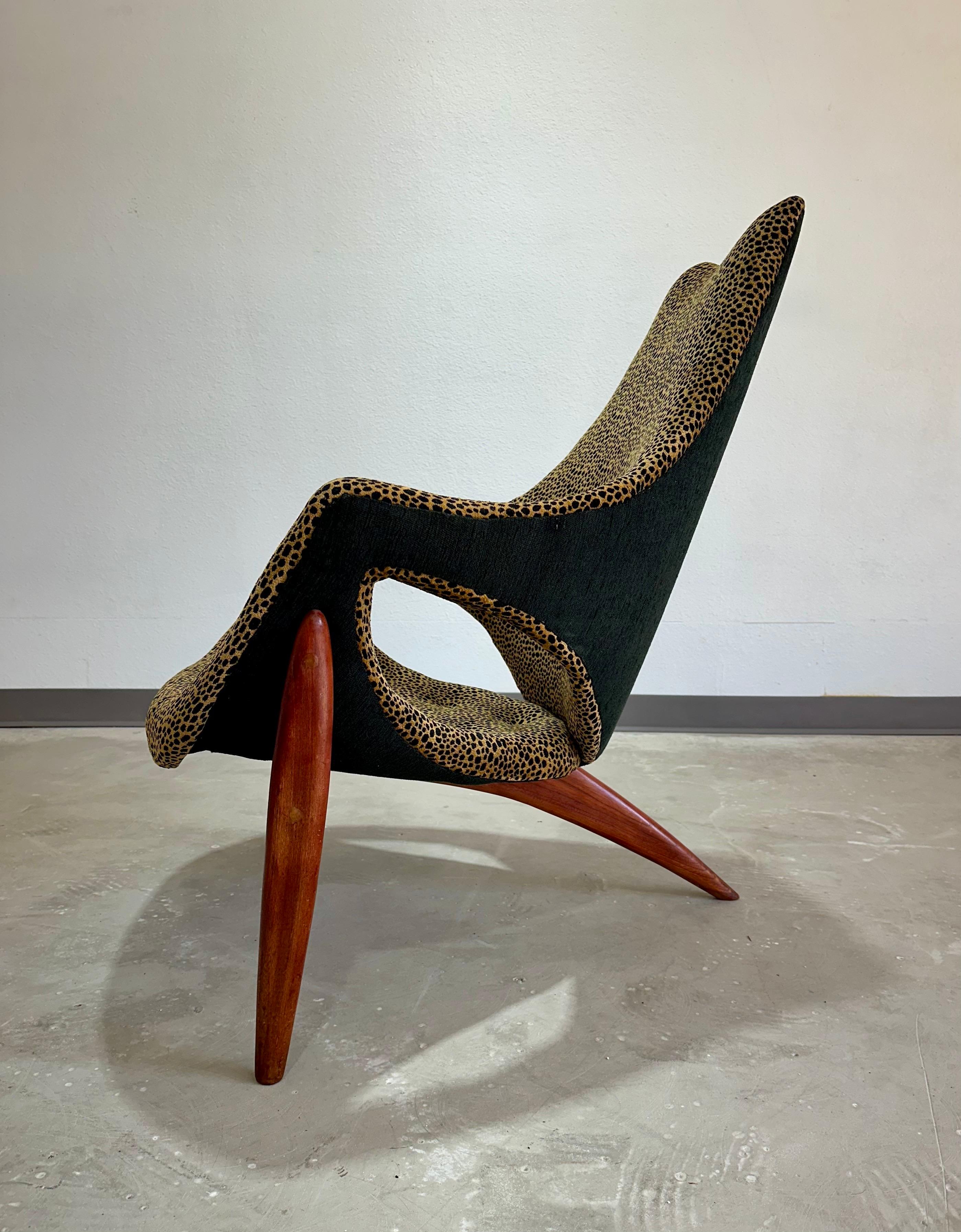 Uncommon Luigi Tiengo for Cimon Montréal Canada c.1963 Walnut and Leopard print Lounge Chair. Unique sculptural shape, cut out details, and three legged walnut base. Previously reupholstered in leopard interior and charcoal grey exterior fabric