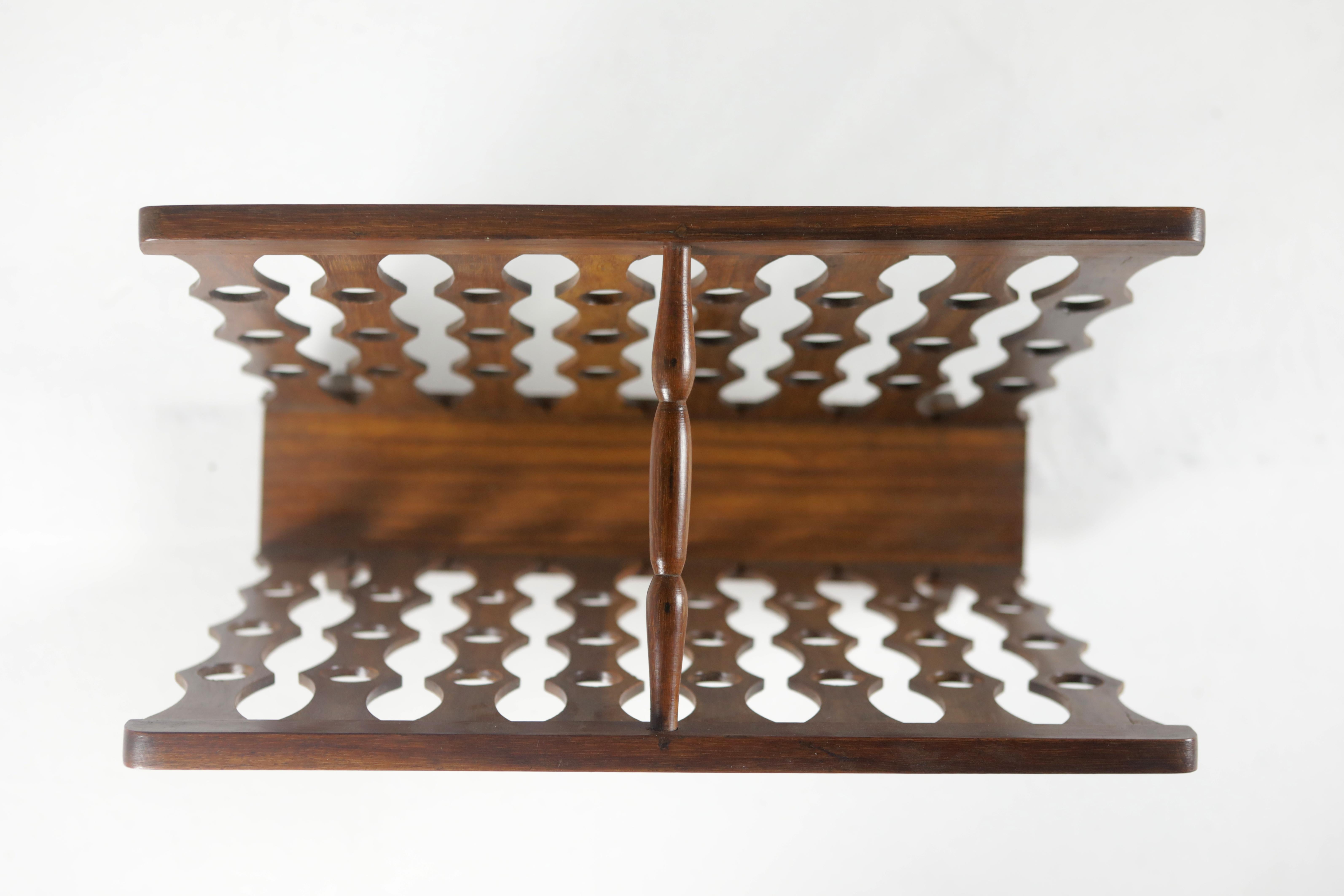 Mid-Century Modern wood magazine rack by Unattributed Brazilian Designer.

Made of solid wood and finished with varnish, this piece is part of a set of magazine racks and other pieces by unknown Brazilian artists from the 50's.