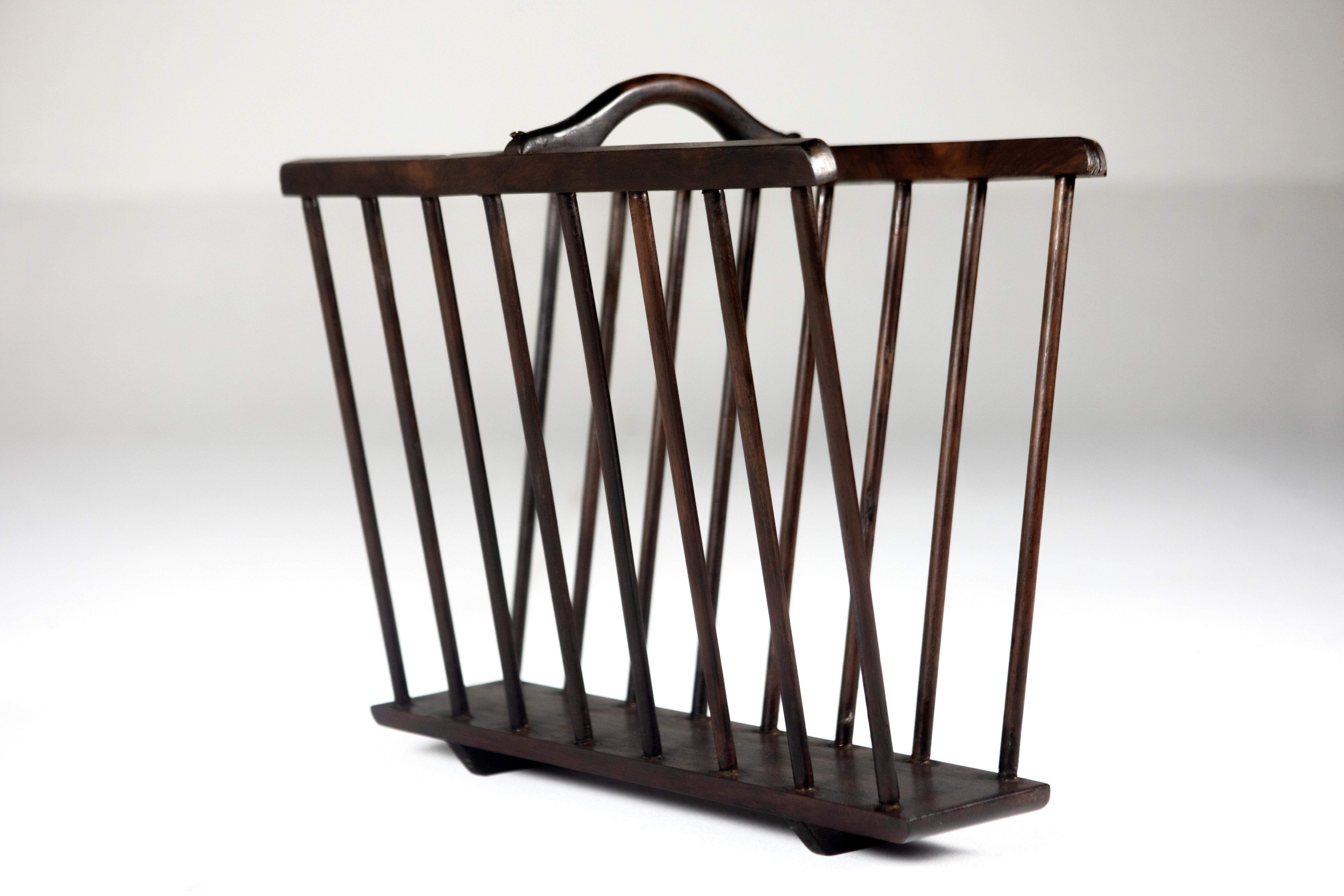 Mid-Century Modern wood magazine rack by Unattributed Brazilian Designer.

Made of solid wood and finished with varnish, this piece is part of a set of magazine racks and other pieces by unknown Brazilian artists from the 50's.