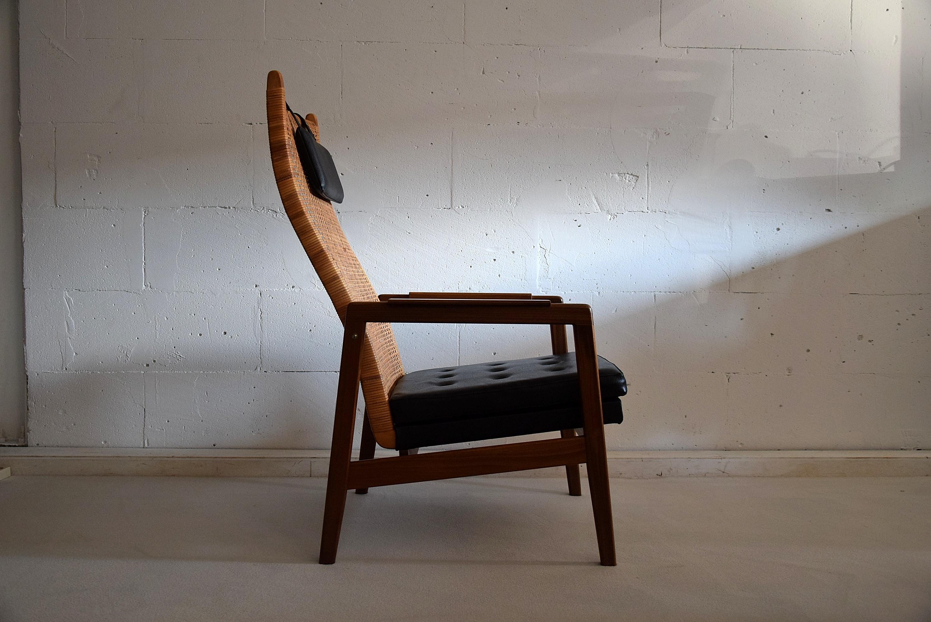 Mid century modern mahogany and wicker lounge Chair by P.Muntendam 1