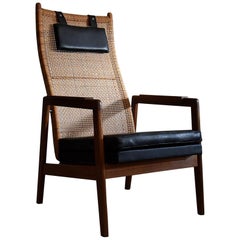 Mid century modern mahogany and wicker lounge Chair by P.Muntendam