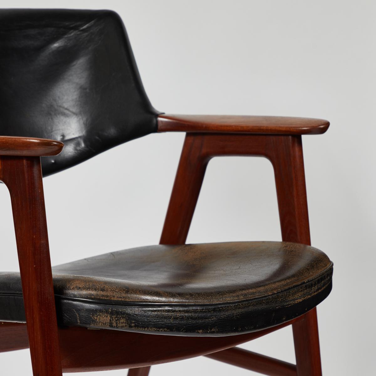French 1940s mahogany armchair with seat and back upholstered in black leather. The smooth elliptical shapes and mid-century modern lines make this a stylish addition to any desk or seating arrangement. 

France, circa 1940

Dimensions: 25W x 25D x
