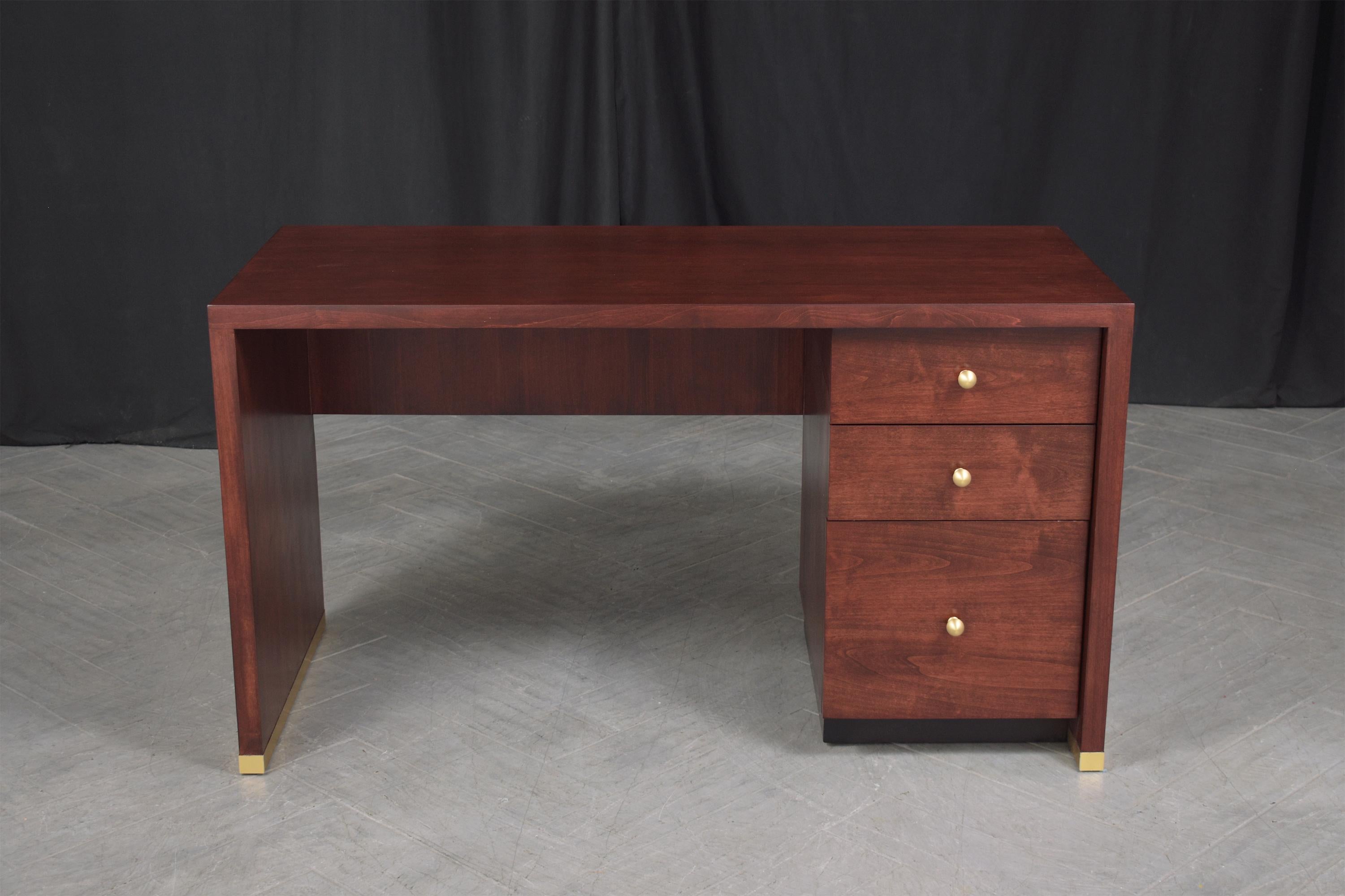 Discover the timeless elegance of our 1970s Mid-Century Modern Desk, a vintage gem meticulously restored to its original glory by our dedicated team. Crafted from quality mahogany wood, this executive desk serves as a testament to unparalleled