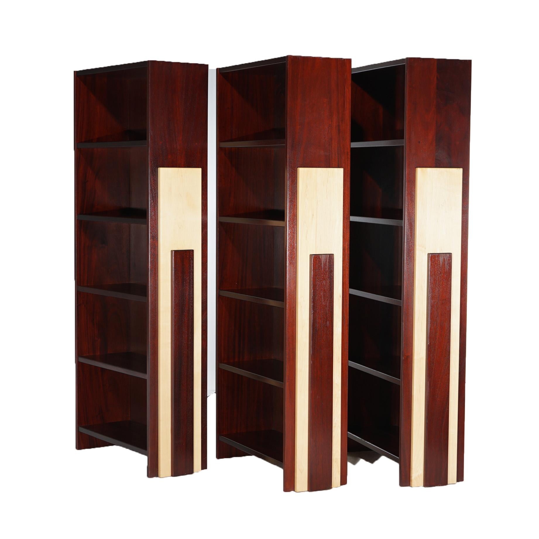 A set of three Mid Century Modern bookcases offer mahogany construction with open shelves and cut-out maple facing on sides, 20thC


Measures- 81.75''H x 35.5''W x 13.5''D