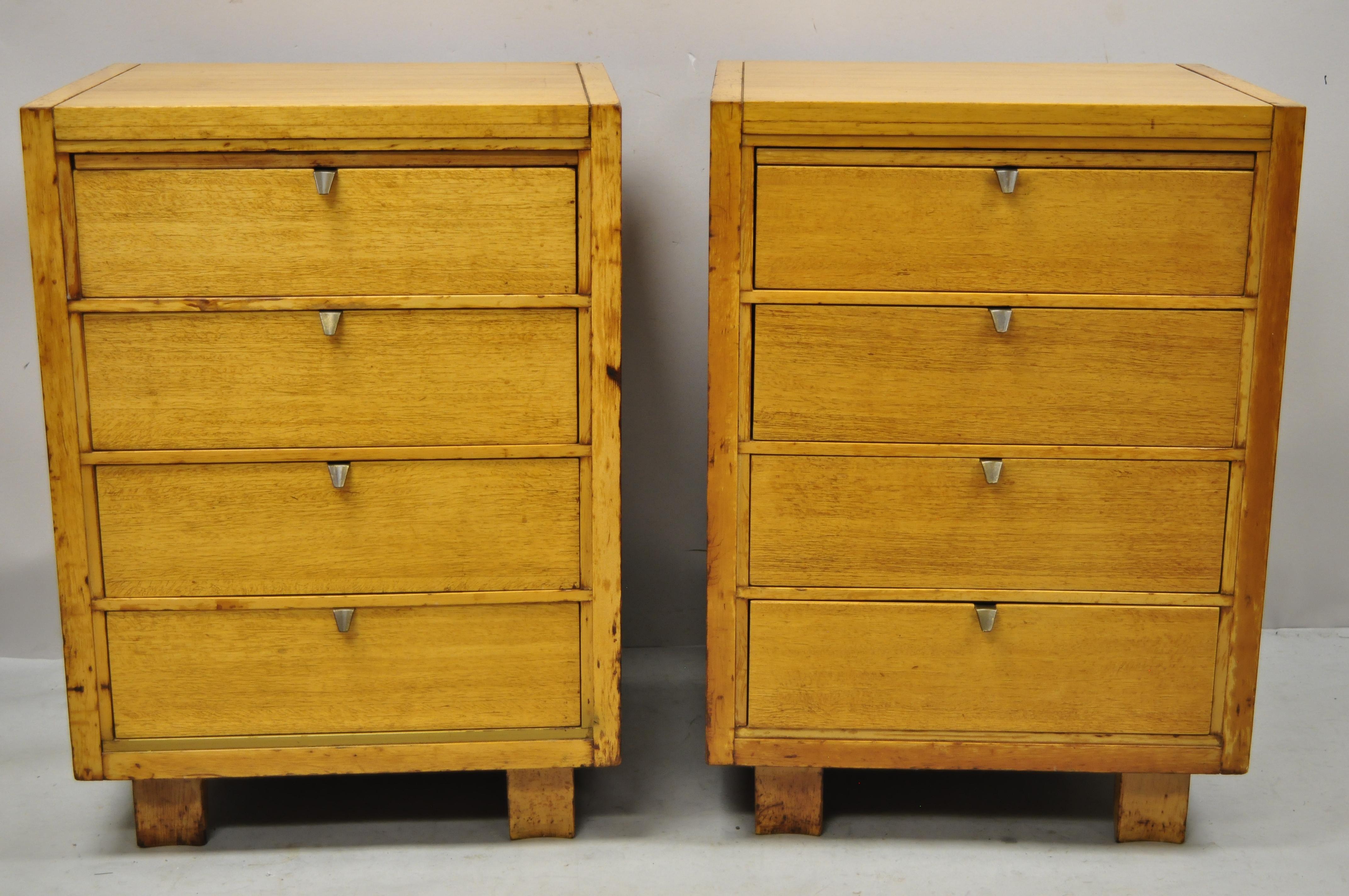 Mid-Century Modern mahogany Paul McCobb style 4 drawer chest nightstands - a pair. Item features shaped and angled legs, maker unconfirmed but quality and style similar to Paul McCobb, beautiful wood grain, 4 dovetailed drawers, solid brass