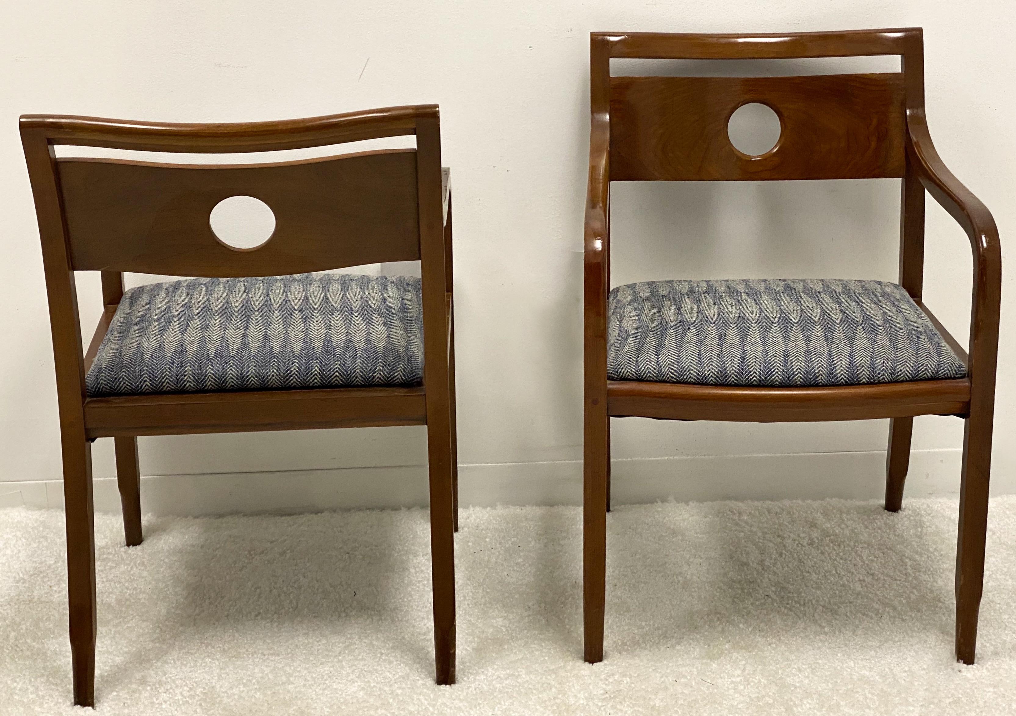 This is a pair of Mid-Century Modern mahogany Ward Bennett bent wood arm chairs. They are marked with the red metal tag, and there are two pairs available. The fabric is navy and cream herringbone and is in very good condition.