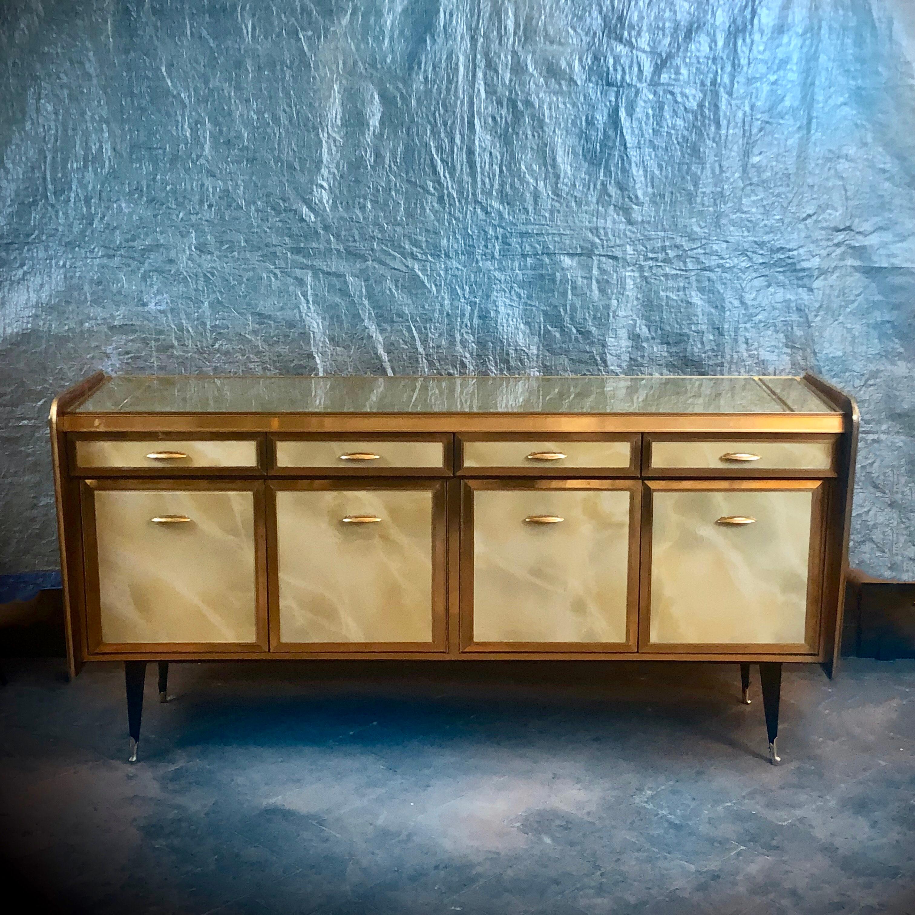 Artistic Murano glass to imitate onyx on the four drawers and doors. 
Mahogany wood visible only on the sides. Solid green/gold glass on top.
The body depth without the bulging laterals is 44 cm.