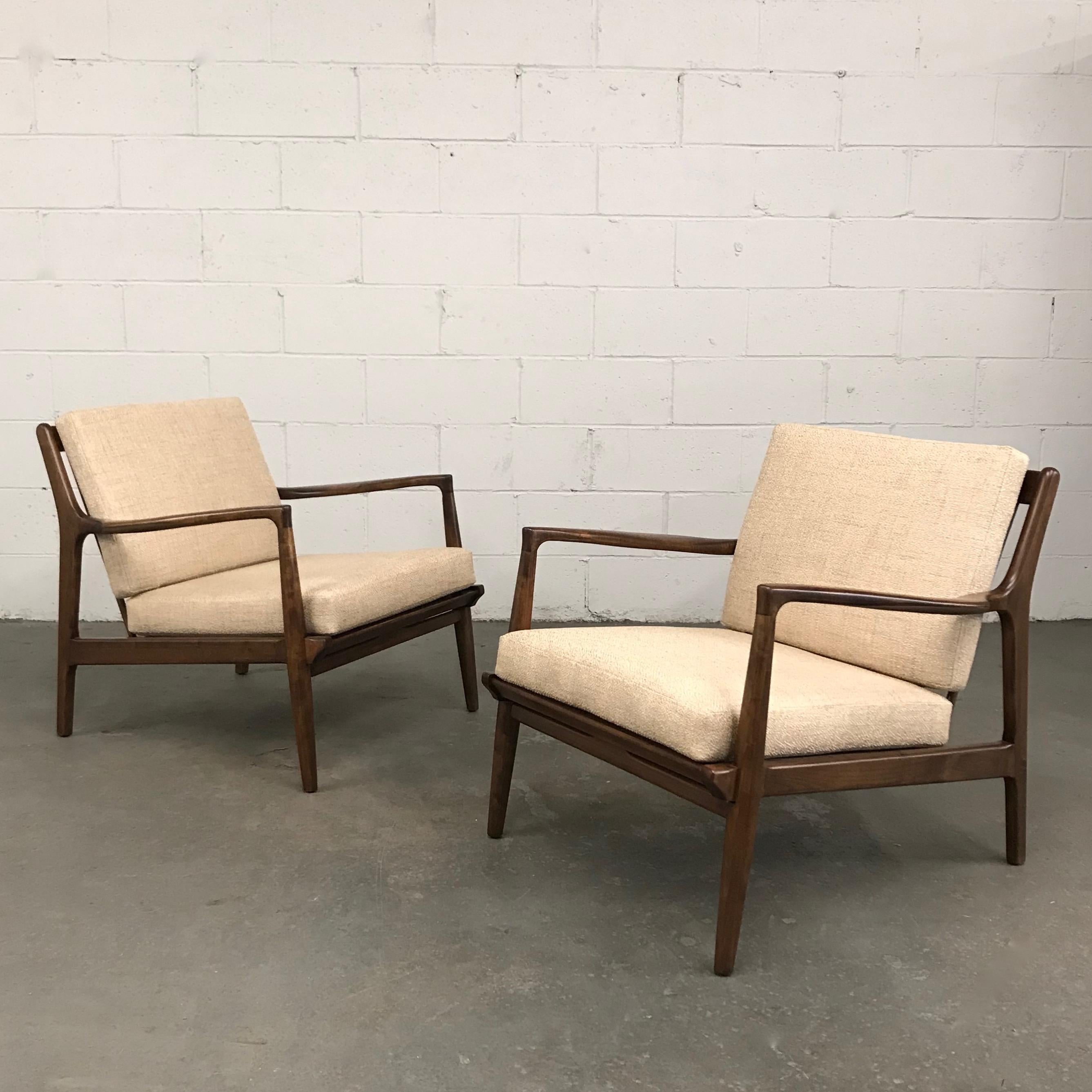 Pair of sleek, low profile, Mid-Century Modern, lounge chairs feature newly restored maple frames with slat backs with newly upholstered cushions.