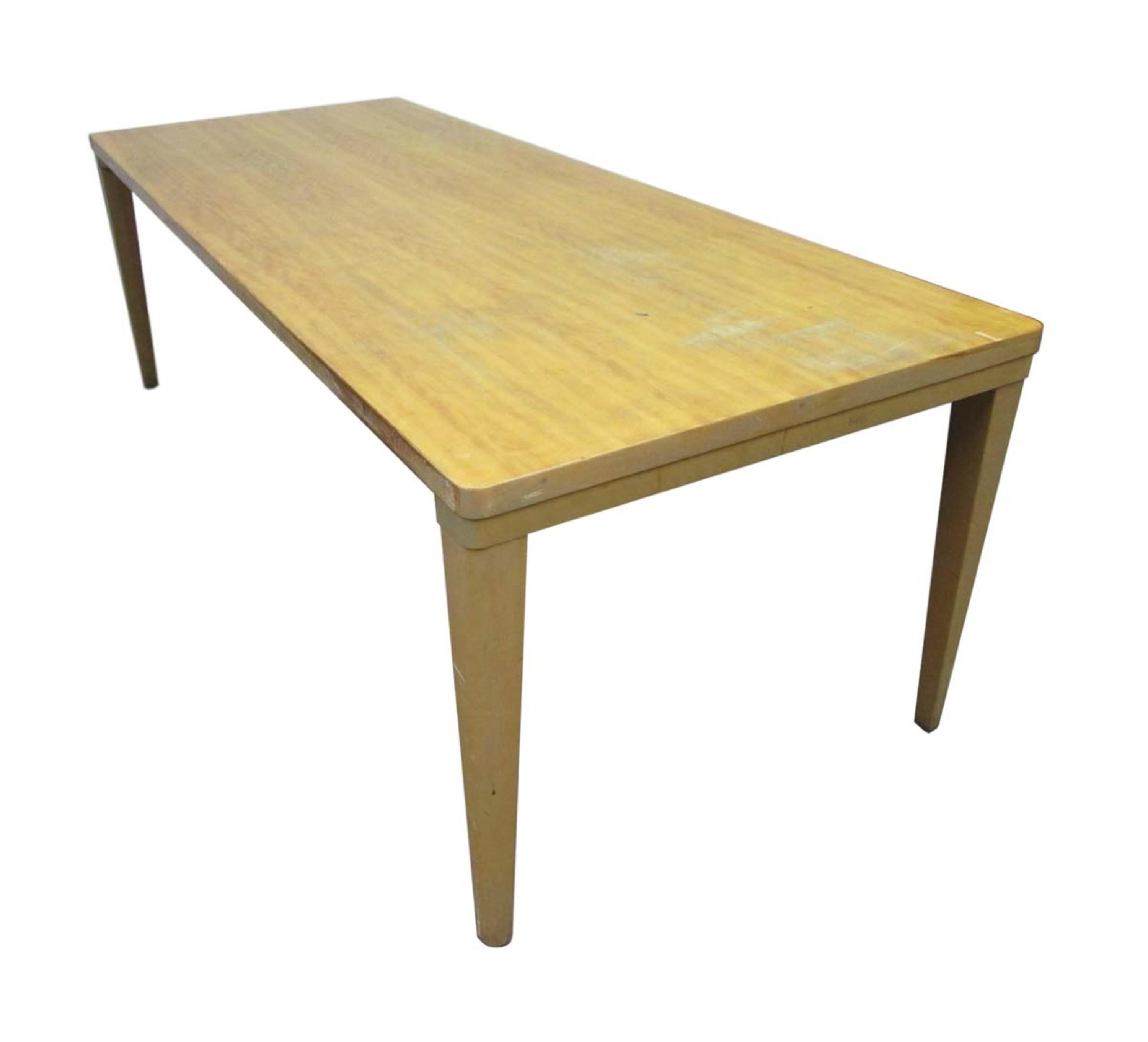 Reclaimed 7.5 ft. sleek maple school tables with tapered legs. These Mid-Century Modern tables can be used for a variety of purposes such as a conference or dining room table or desk. Small quantity available at time of posting. Priced each. Please