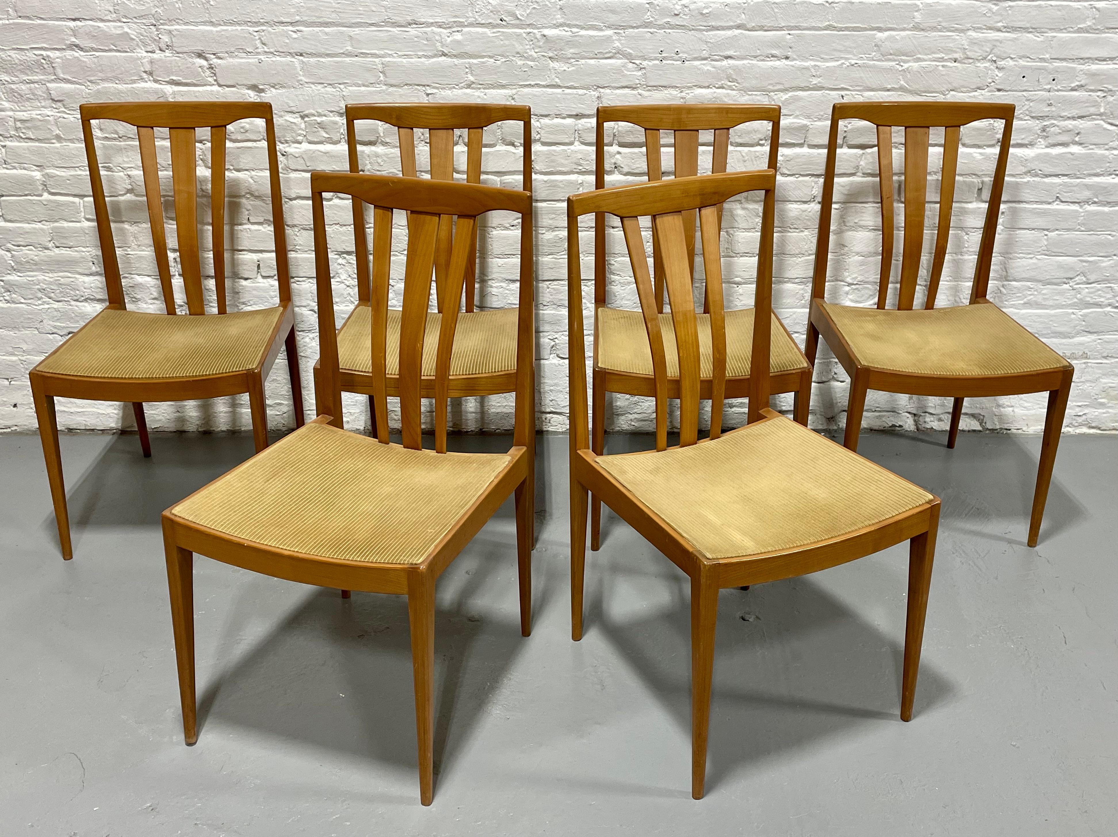 Mid Century Modern Maple Sculpted back Dining Chairs, set of 6. These solid maple dining chairs have gorgeous sculpted back supports and neutral light mustard velour upholstered seats. The legs are tapered and are both elegant and evoke a beautiful